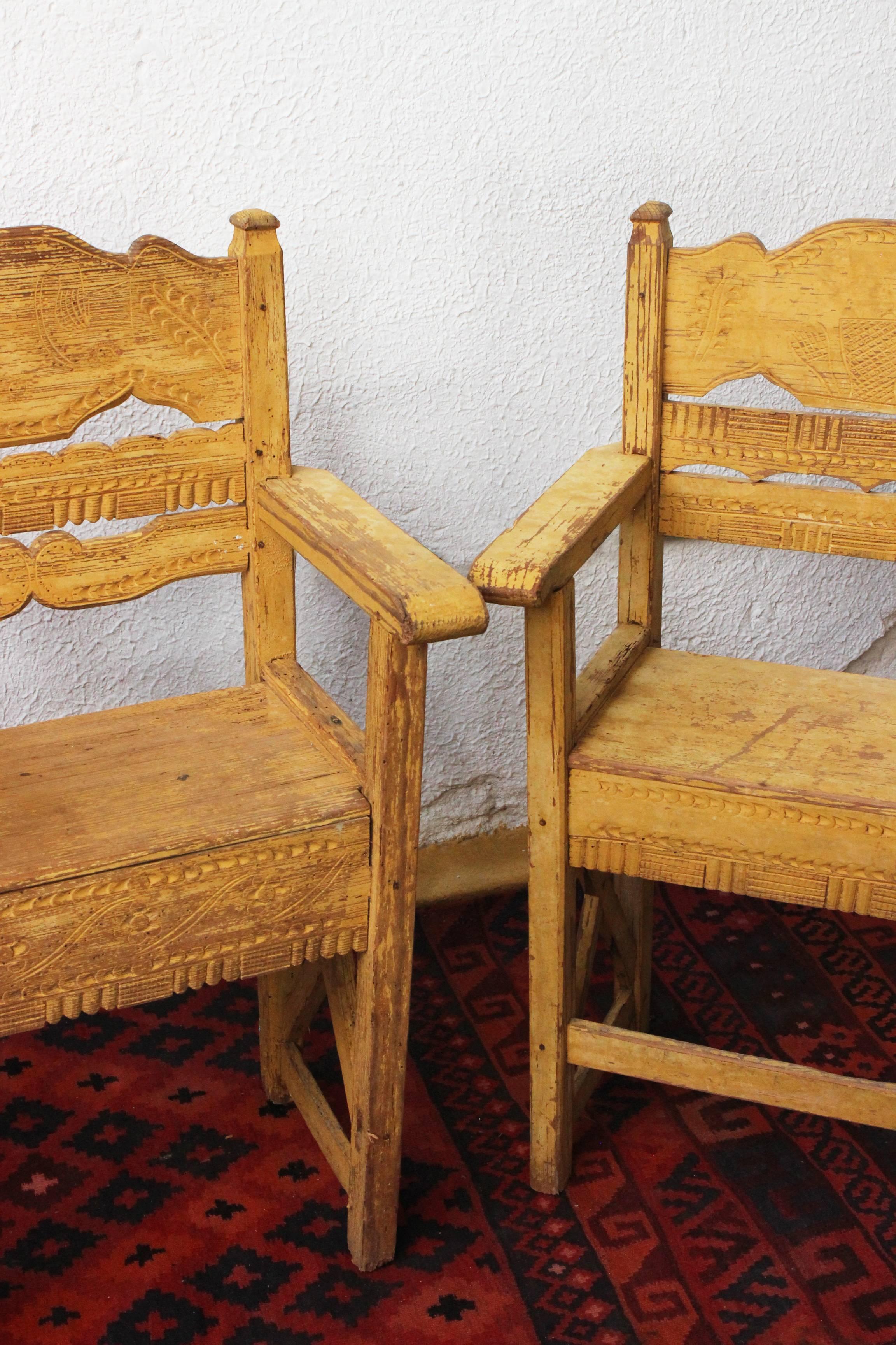 Handmade late 19th century pair of chairs with typical hand carving from Western México.