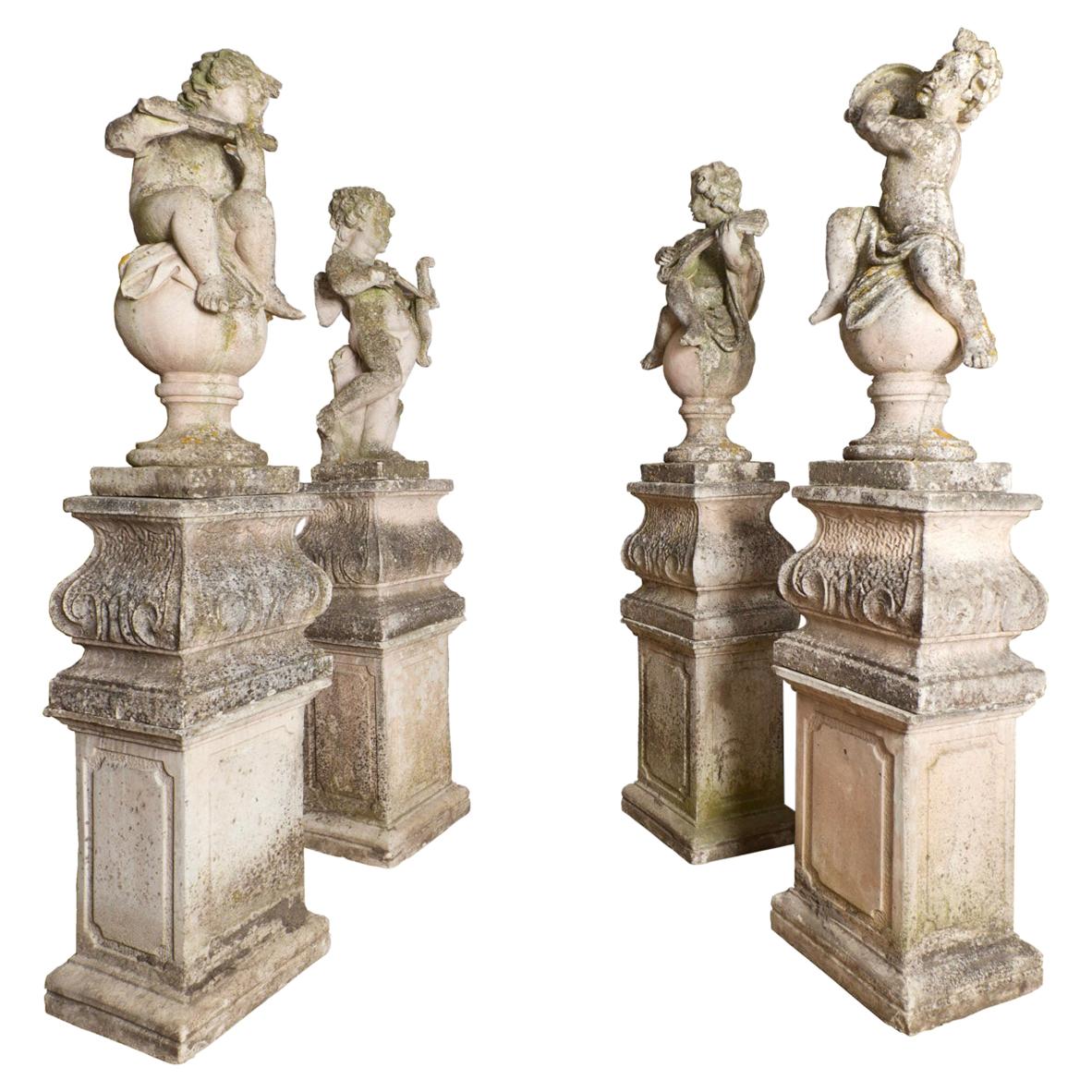 Late 19th Century Set of Four Baroque Style Cast Stone Putti