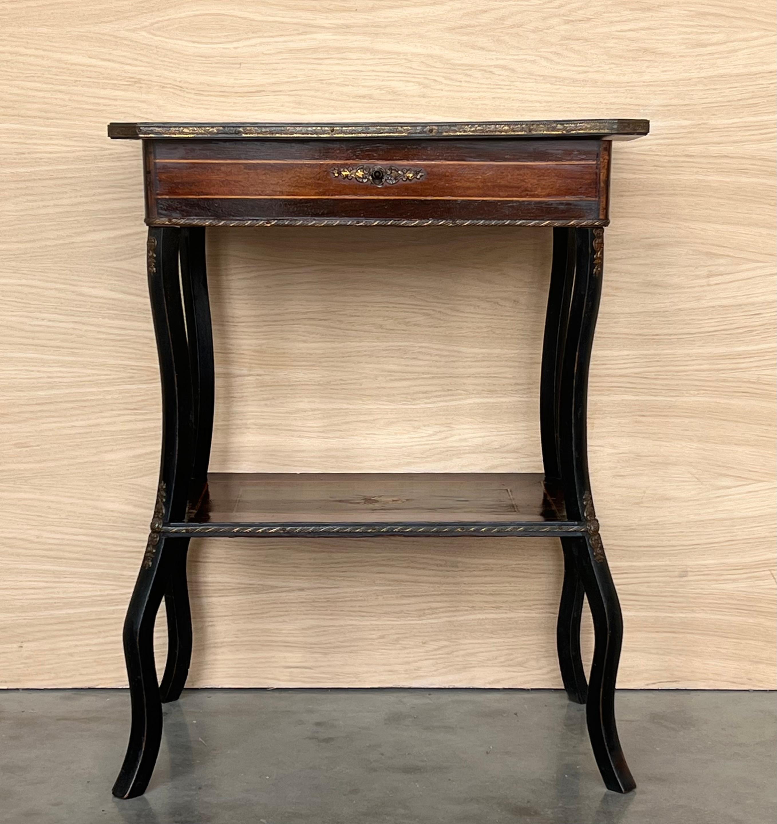 Antique Napoleon III sewing table, circa 1880 The marquetry is made of various woods. A brass feast surrounds the table top. The lift-up lid opens up to reveal a new mirror and compartments.