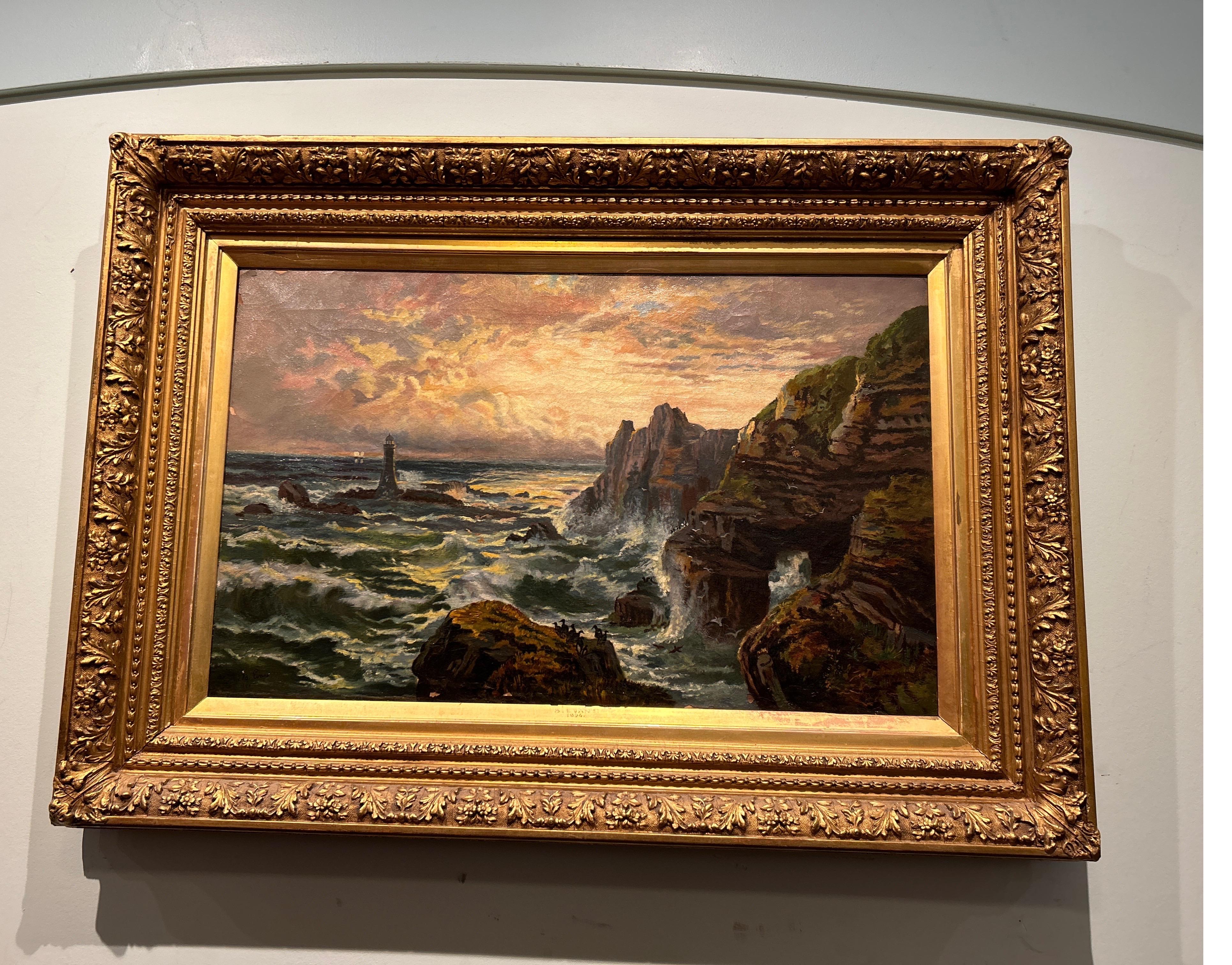 Signed English oil on canvas beautifully depicting cliffs and crashing waves on a rocky shoreline with cormorants at sunset. The original plaster of Paris frame shows beautifully. Some chips to the paint work visible on the canvas but otherwise the