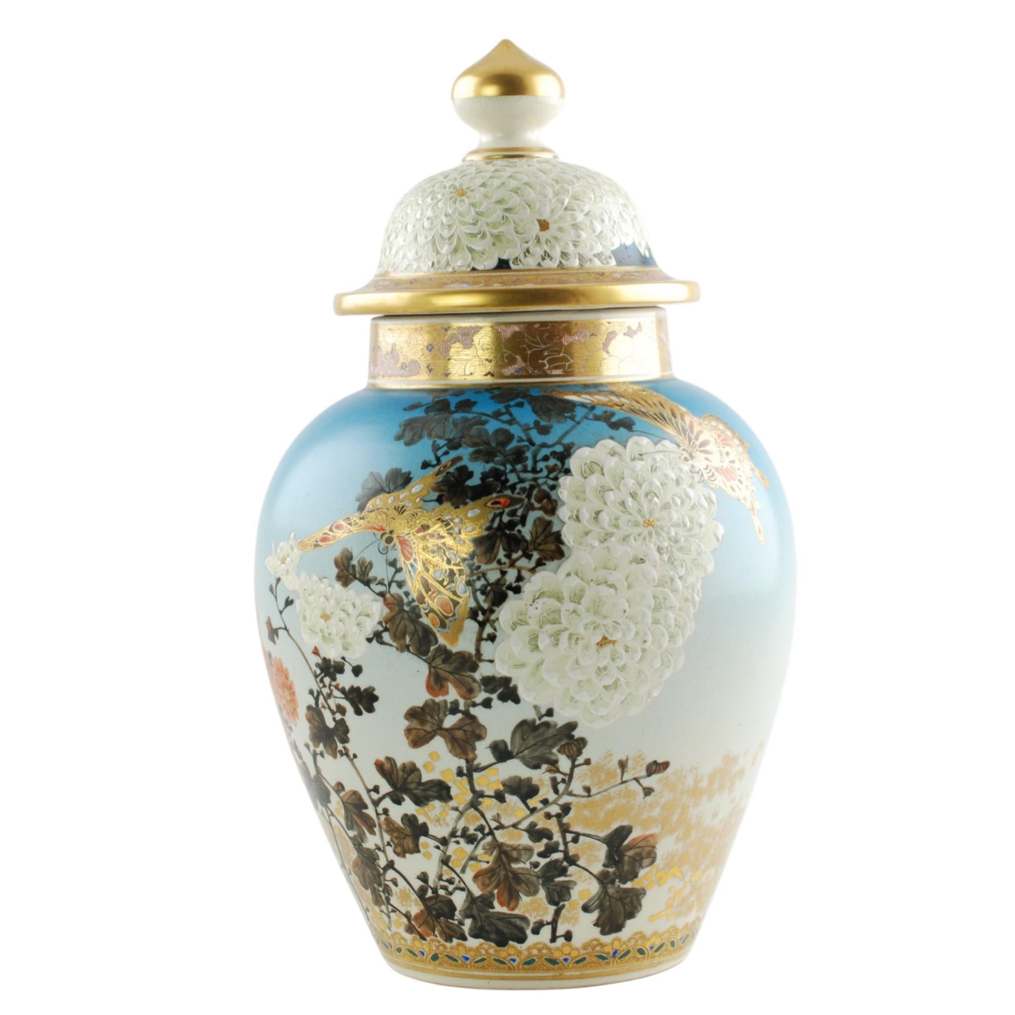 This outstanding late 19th century Japanese Satsuma porcelain covered temple jar has a traditional form with a domed lid. The piece features exquisite hand painted decoration which includes brightly hued flowers and associated foliage along with