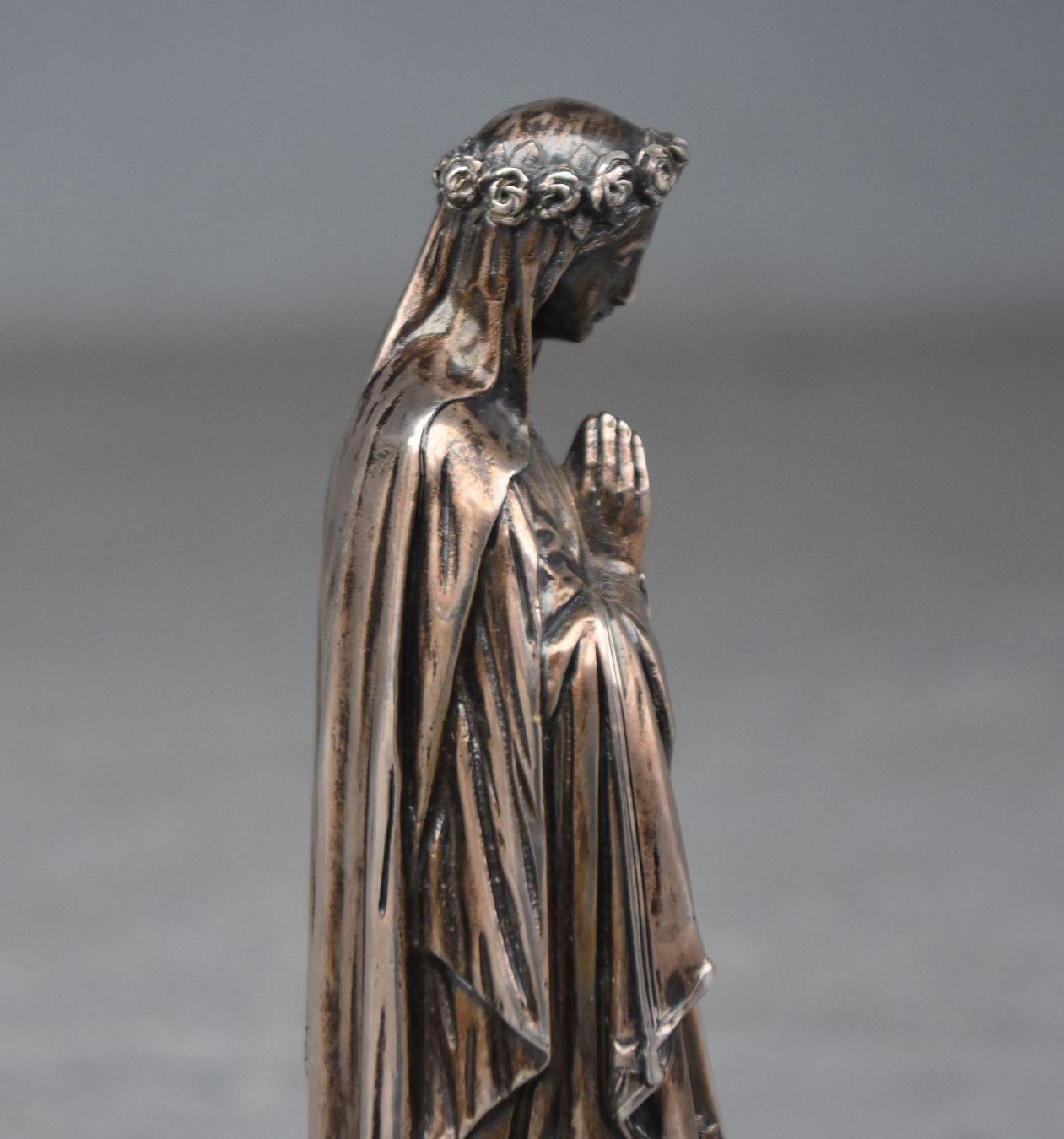 silver virgin mary statue