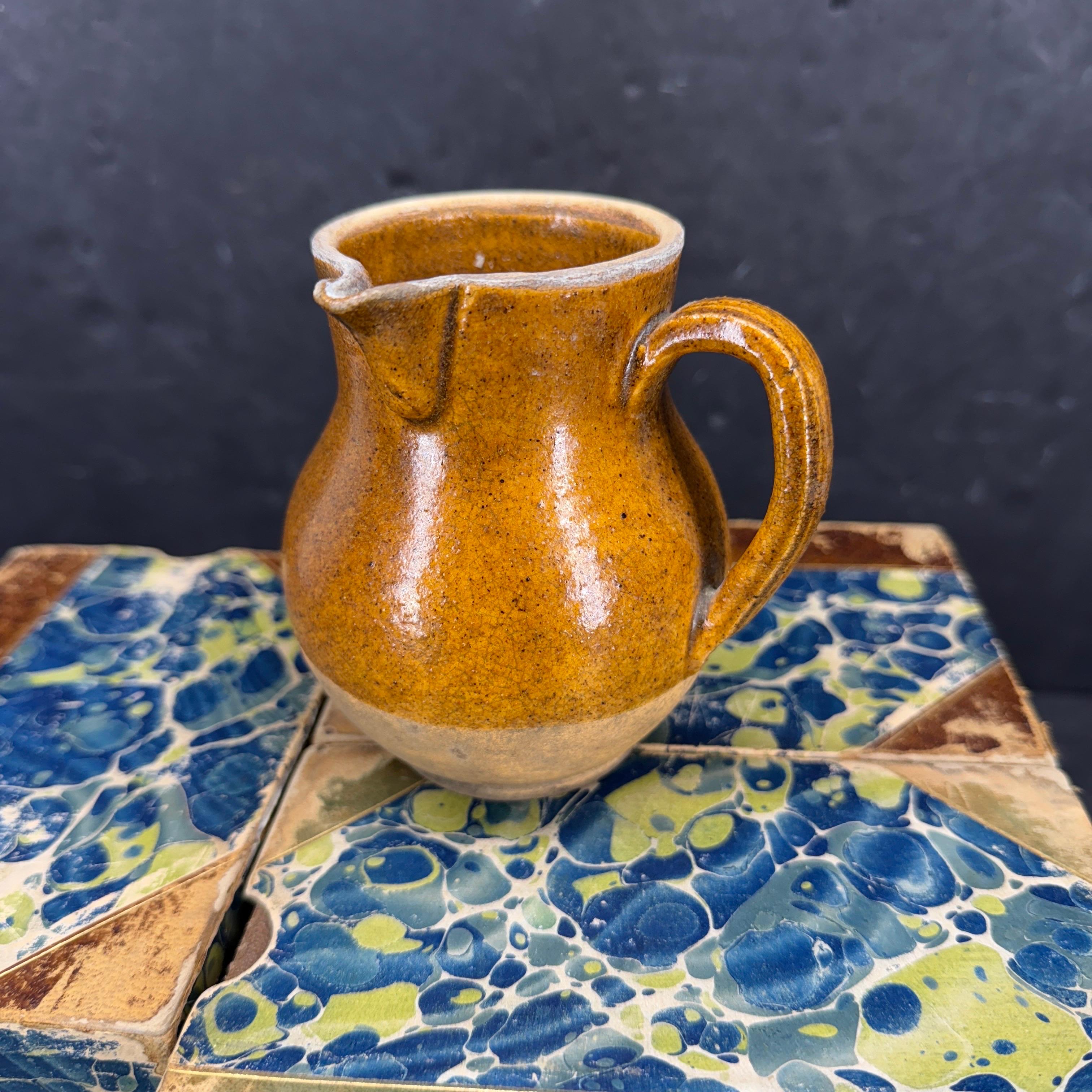 Found in a market north of Paris, this small antique French pitcher dates from the Late-19th Century. Charming jug standing alone or as a vase with fresh flowers inside. We also see this being used as a creamer on a table. This pot would make a