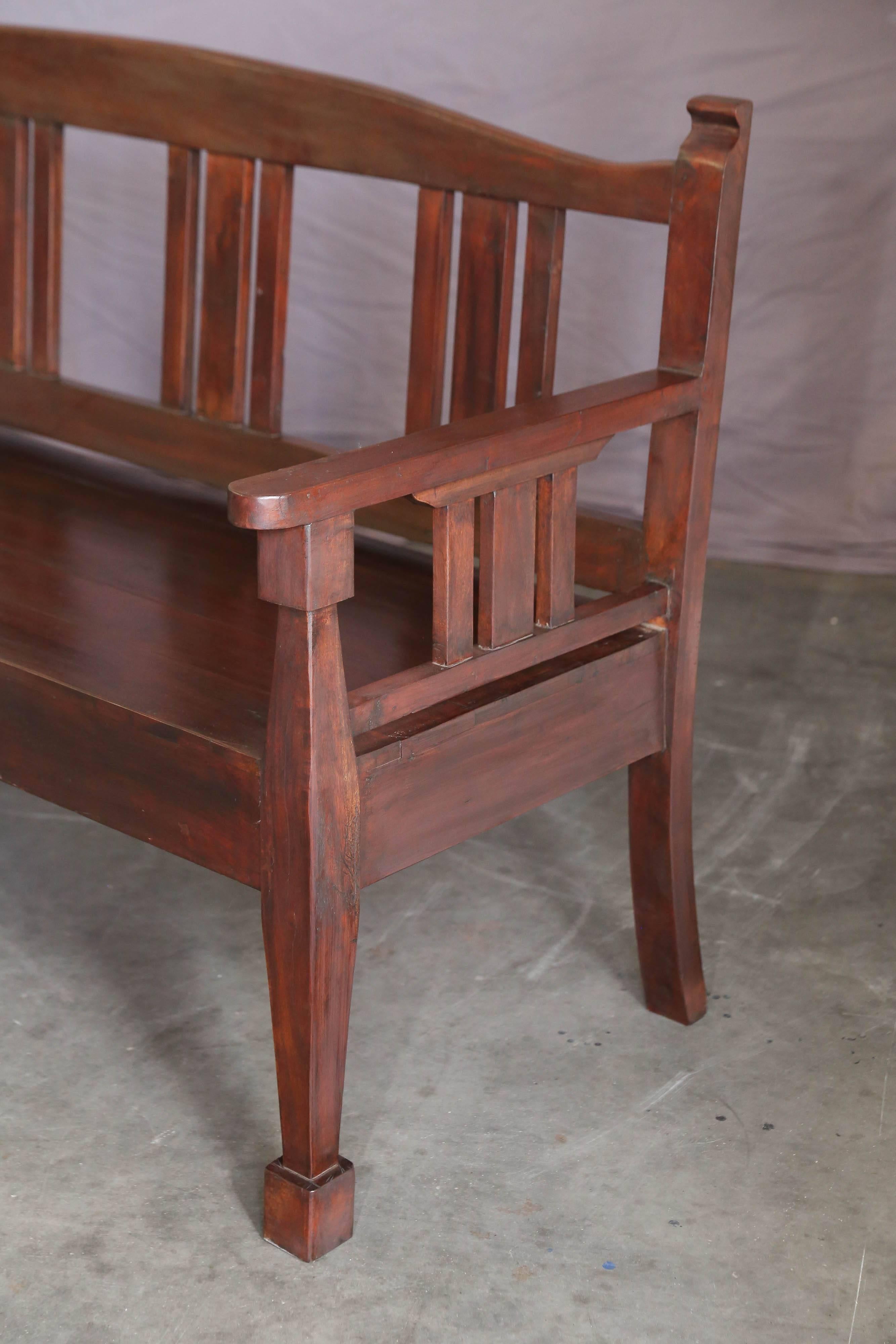 Made on commission for the owners of tea plantation situated on the hill station Darjeeling. Heavily built with no regard to cost. Supported on four sturdy legs, back and arm rests . Old world carpentry. Rich teak wood patina. Used in any style