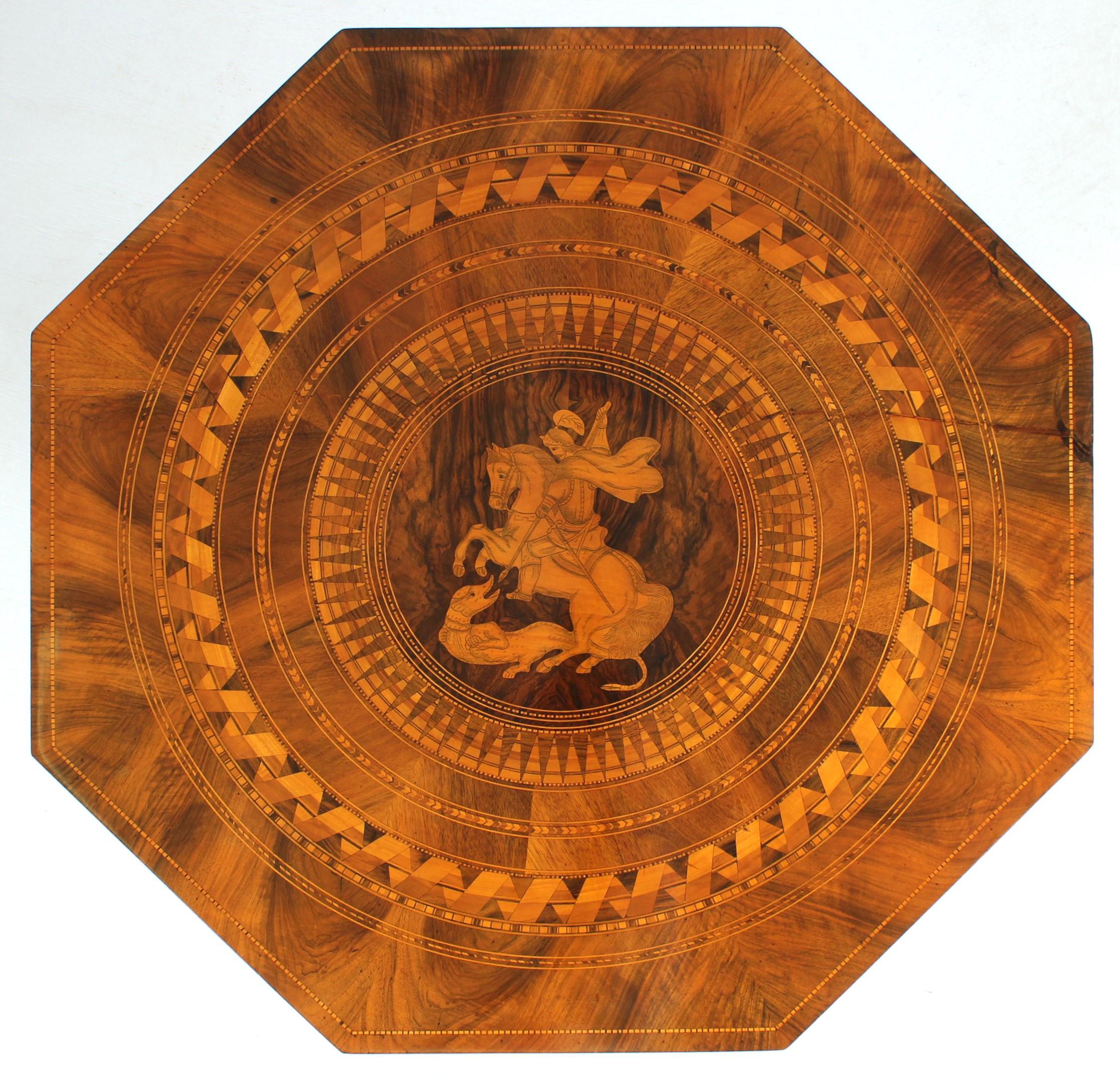 Antique side table - George fighting the dragon

Italy
Walnut a.o.
Historicism around 1880

Dimensions: H x W x D: 73 cm x 74 cm x 74 cm

Description:
Very richly inlaid and marquetry piece of furniture.
Baluster base with fillet band made of maple