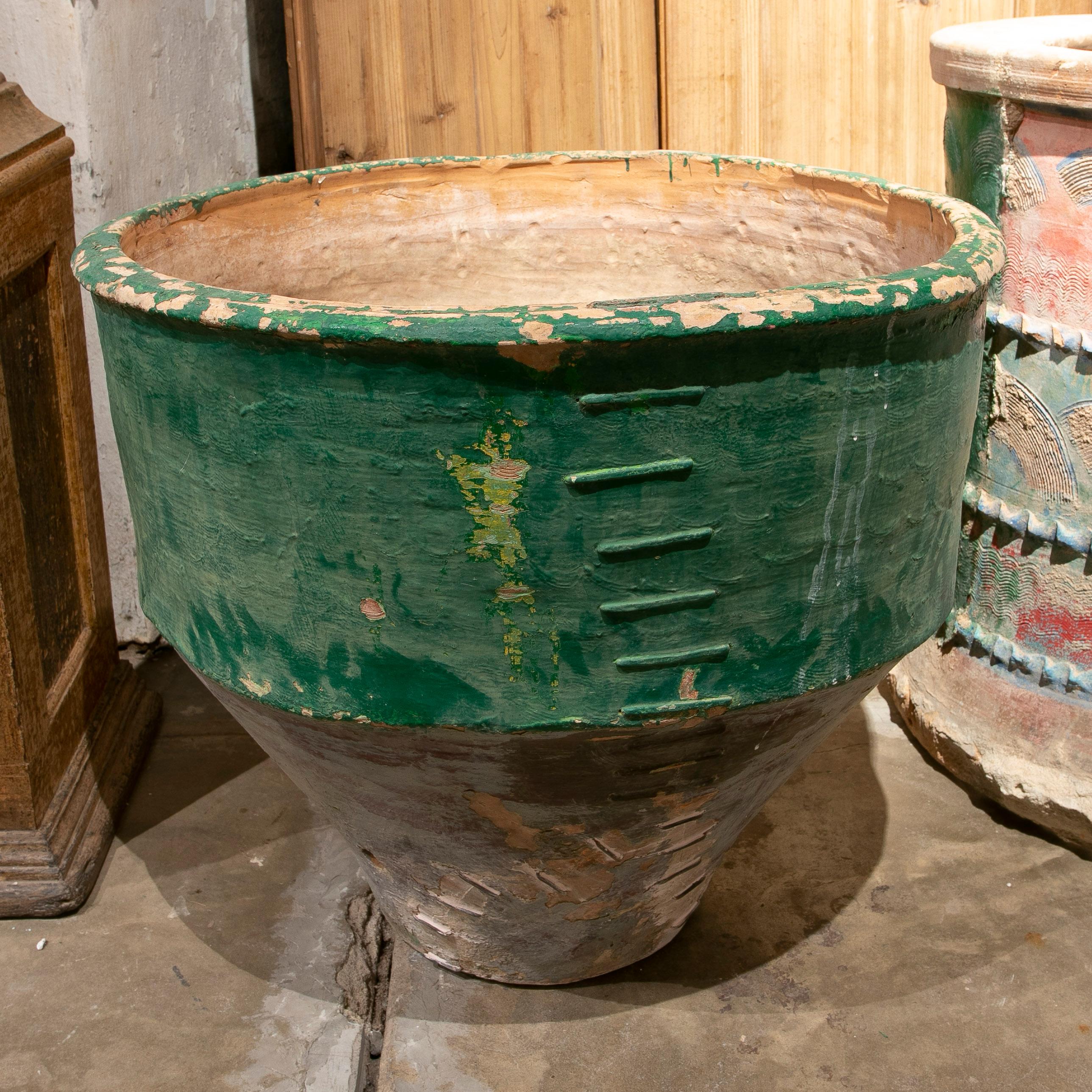 Late 19th century Spanish green terracotta vase urn restored with staples.
