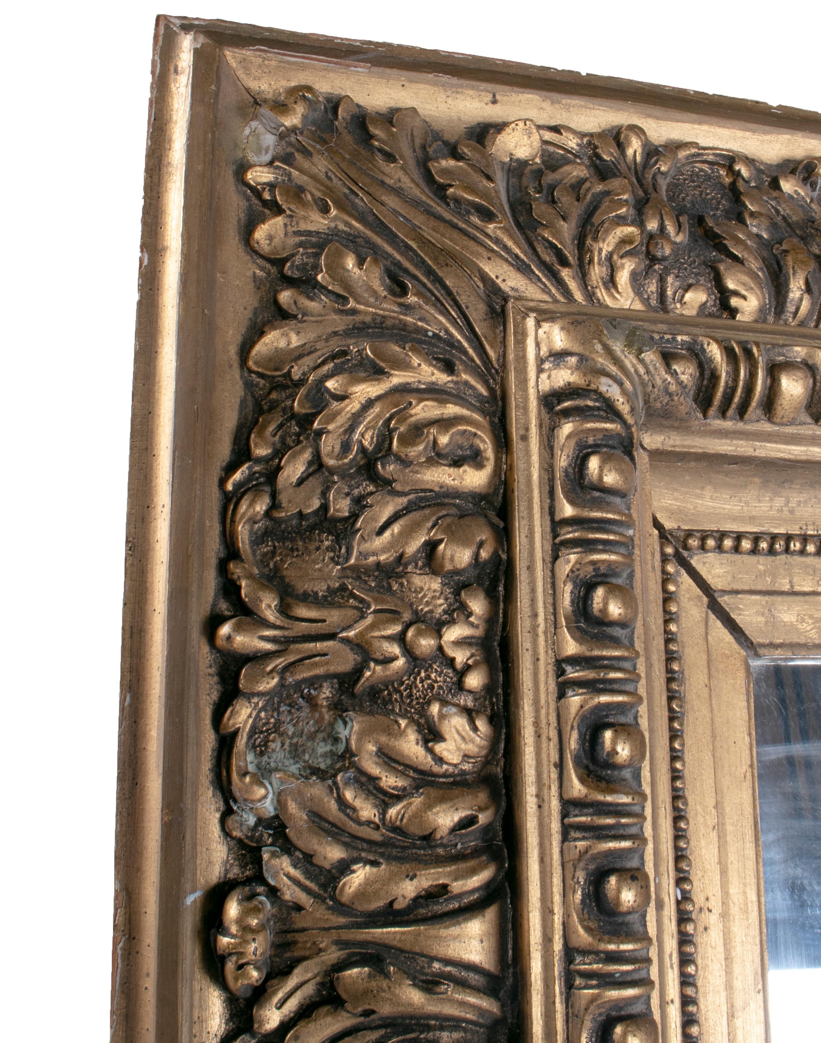 Late 19th century Spanish rectangular mirror with ornamental gilded frame.