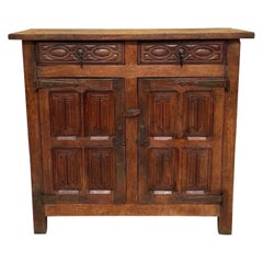 Late 19th Century Spanish Rustic Oak Cabinet with Hand-Carved Panels