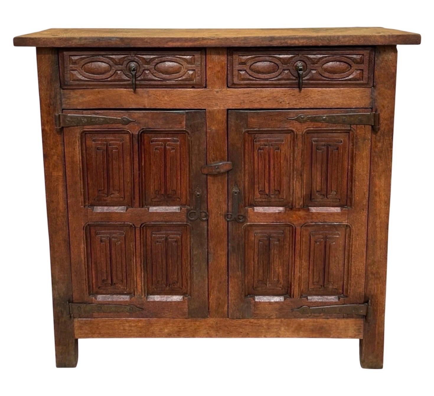 Late 19th Century Spanish Rustic Oak Cabinet with Hand-Carved Panels