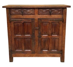 Late 19th Century Spanish Rustic Oak Cabinet with Hand-Carved Panels