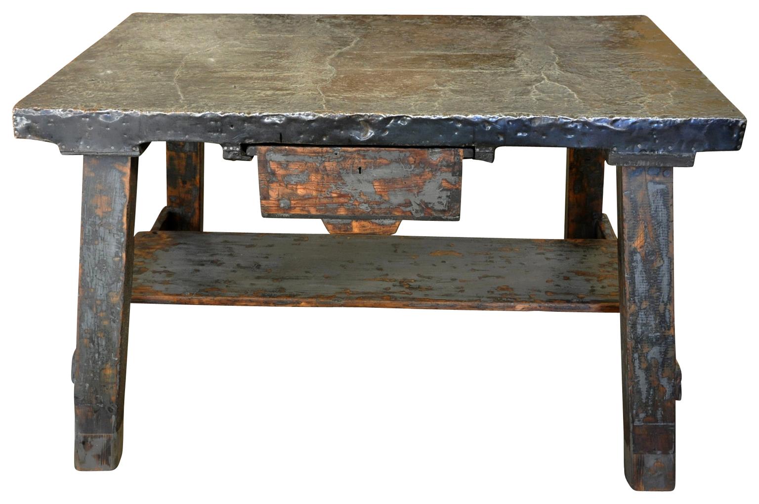A terrific later 19th century work table, Etabli, from the Catalan region of Spain. Soundly constructed from painted wood with a wonderful zinc clad top and a single drawer. Great patina. A wonderful side table or small kitchen island.

       