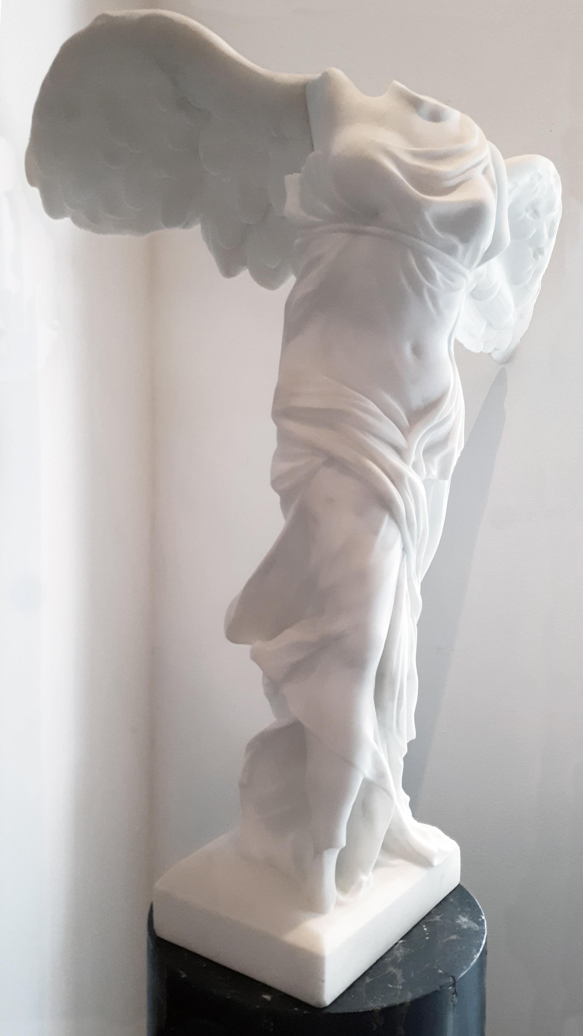 A late 19th century statue of the Winged Victory of Samothrace. This beautiful antique piece is made of a Carrara marble of statuary quality and is a copy of the Hellenistic sculpture of Nike (the Greek goddess of victory), that was created in circa