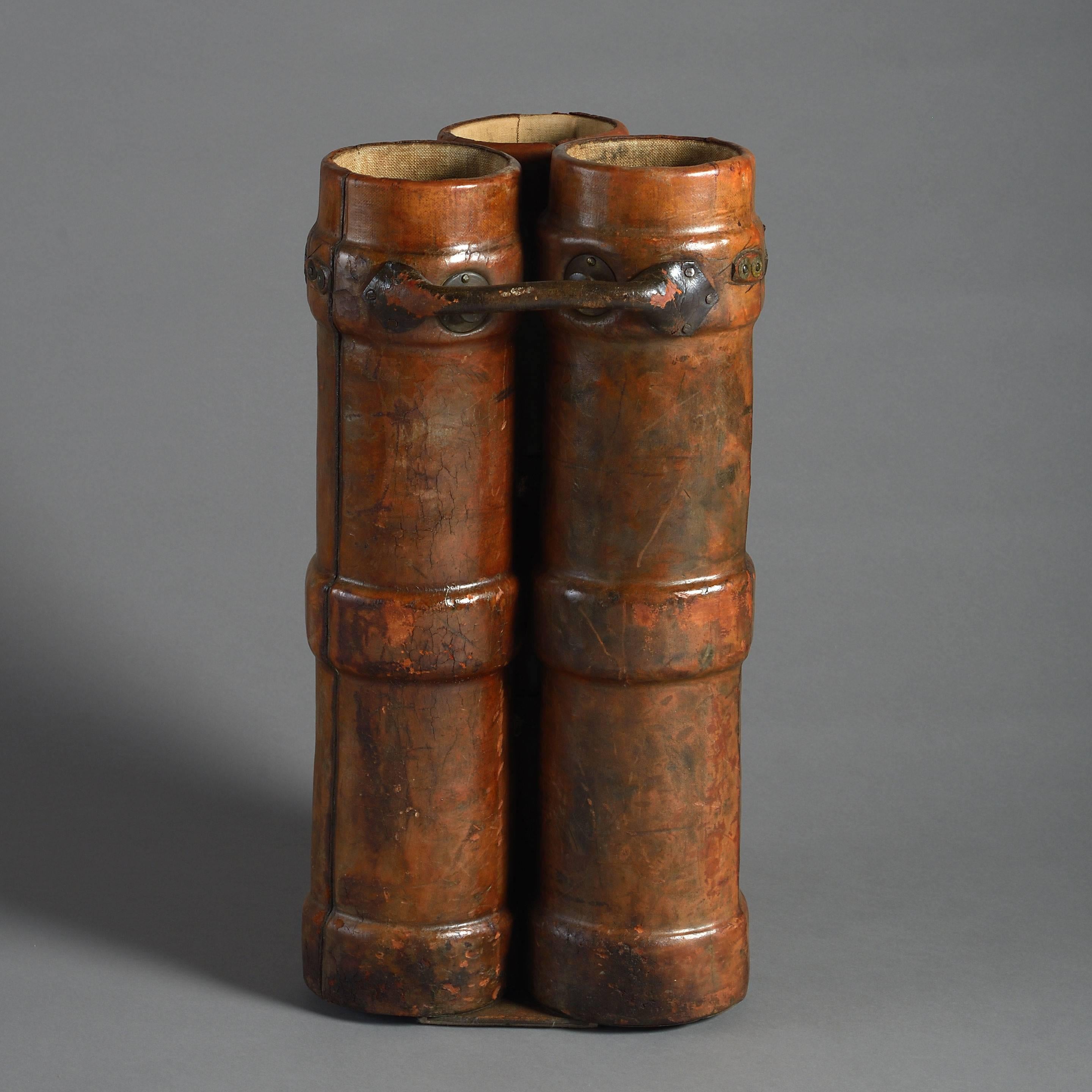 A rare late 19th century stitched leather military shell holder with three cases and decorated with the Royal Arms.