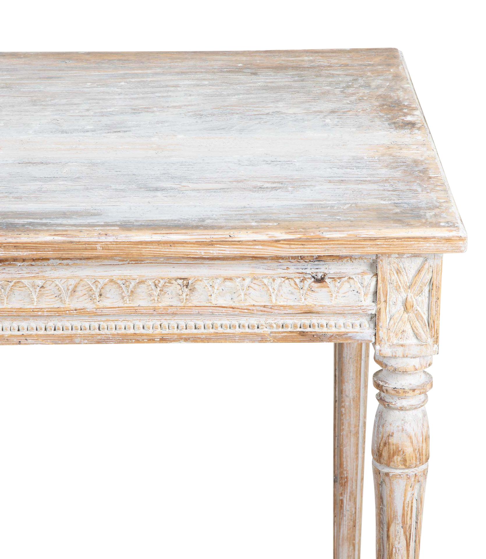 A late 19th Century Gustavian style desk.
Decorative carved detailing around the stretch on all four sides. With one drawer, repainted in soft grey. 
Seat height 67cm.