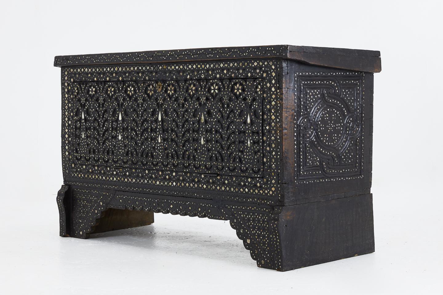 Late 19th century Syrian bone and mother of pearl inlaid chest. The front of the chest is cut out and hinged for easy access to the inside of the chest without having to lift the lid.
 