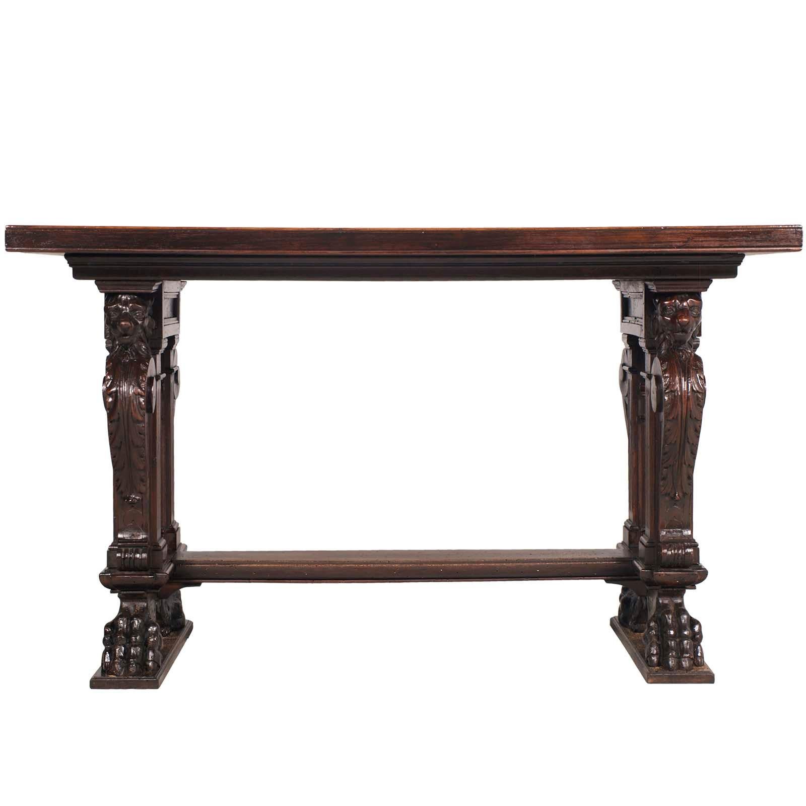 Late 19th century table, writing desk, in hand carved walnut, by Testolini & Salviati.
The important desk is all in solid walnut, with a veneered top. Neoclassical legs with 4 lions carved to remember the symbol of the famous Republic of Venice,
