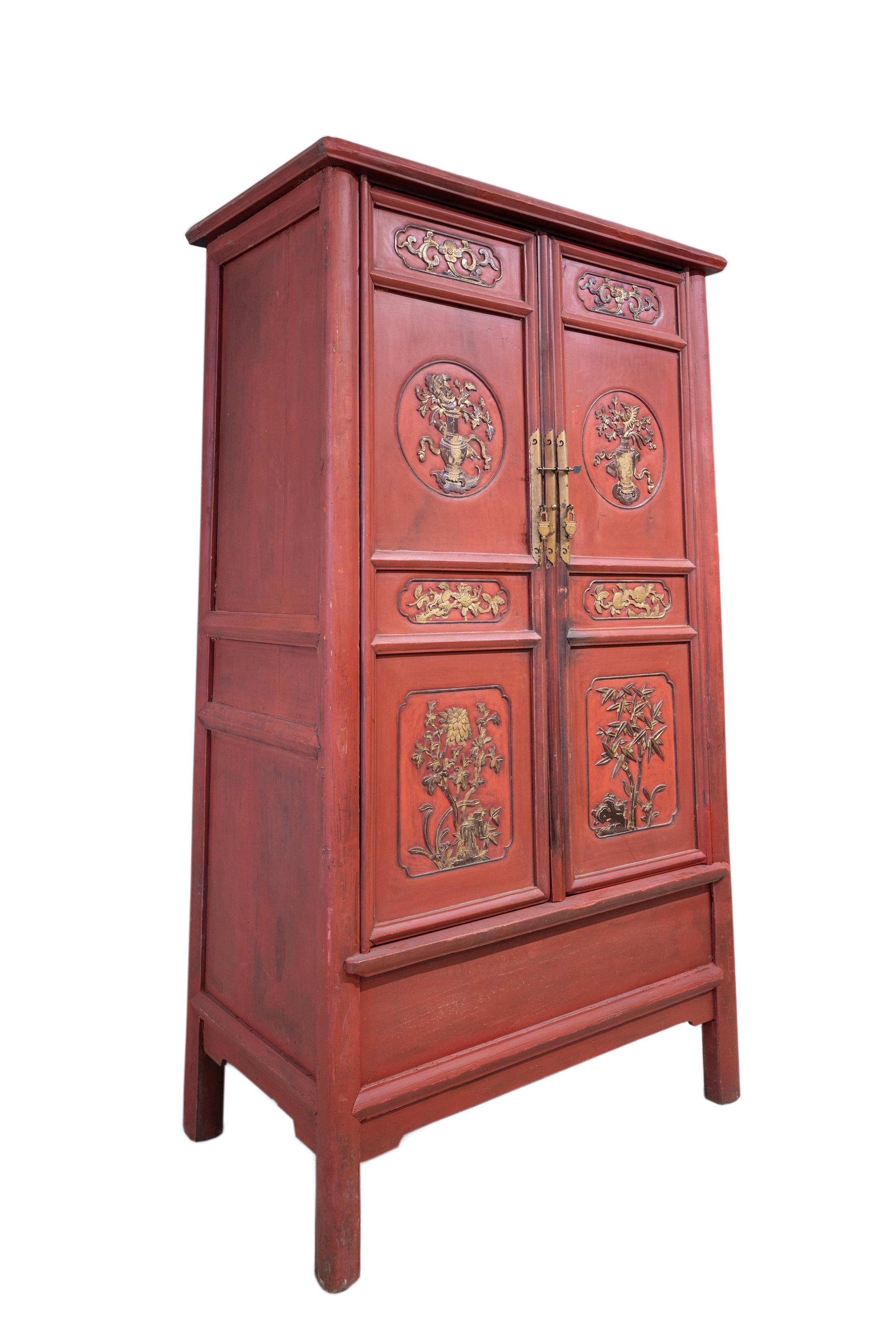 A tall round corner tapered cabinet with relief carvings from the Northern Jiangsu region, commonly known as Subei region, China. The panels are carved with roundels of flowers from the four seasons.
The flowers in the top panels are peony and water
