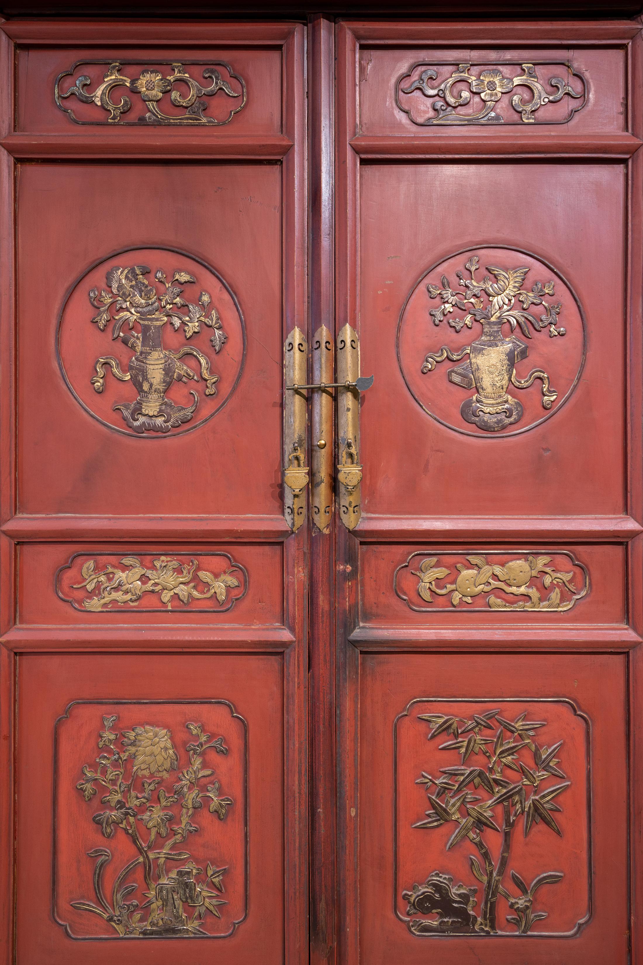 Chinese Late 19th Century Tall Tapered Red & Gold Carved Cabinet For Sale