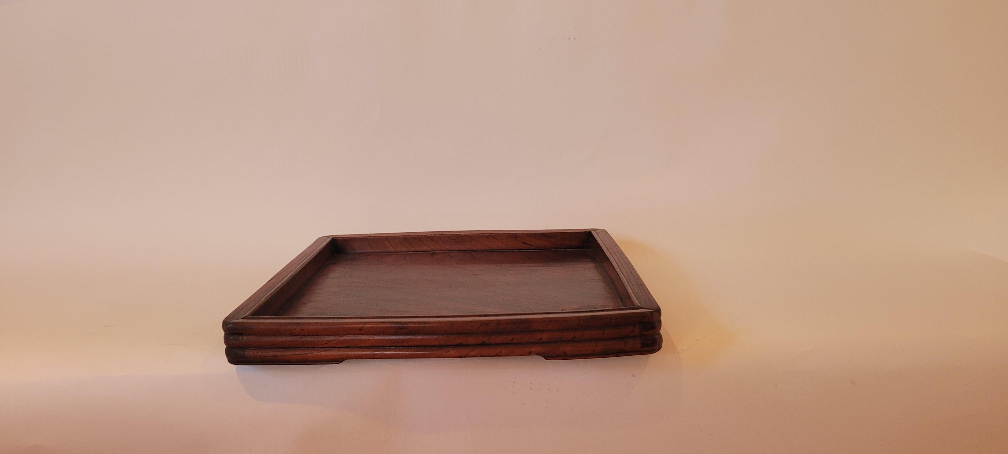Tray
This is a square tea tray with beaded edge beveled frame members and corner small base.

Material:	Jumu (Southern Elm)
Size:		1.25h x 13w x 13d
Origin:		Zhejiang
Age:		Late 19th Century

