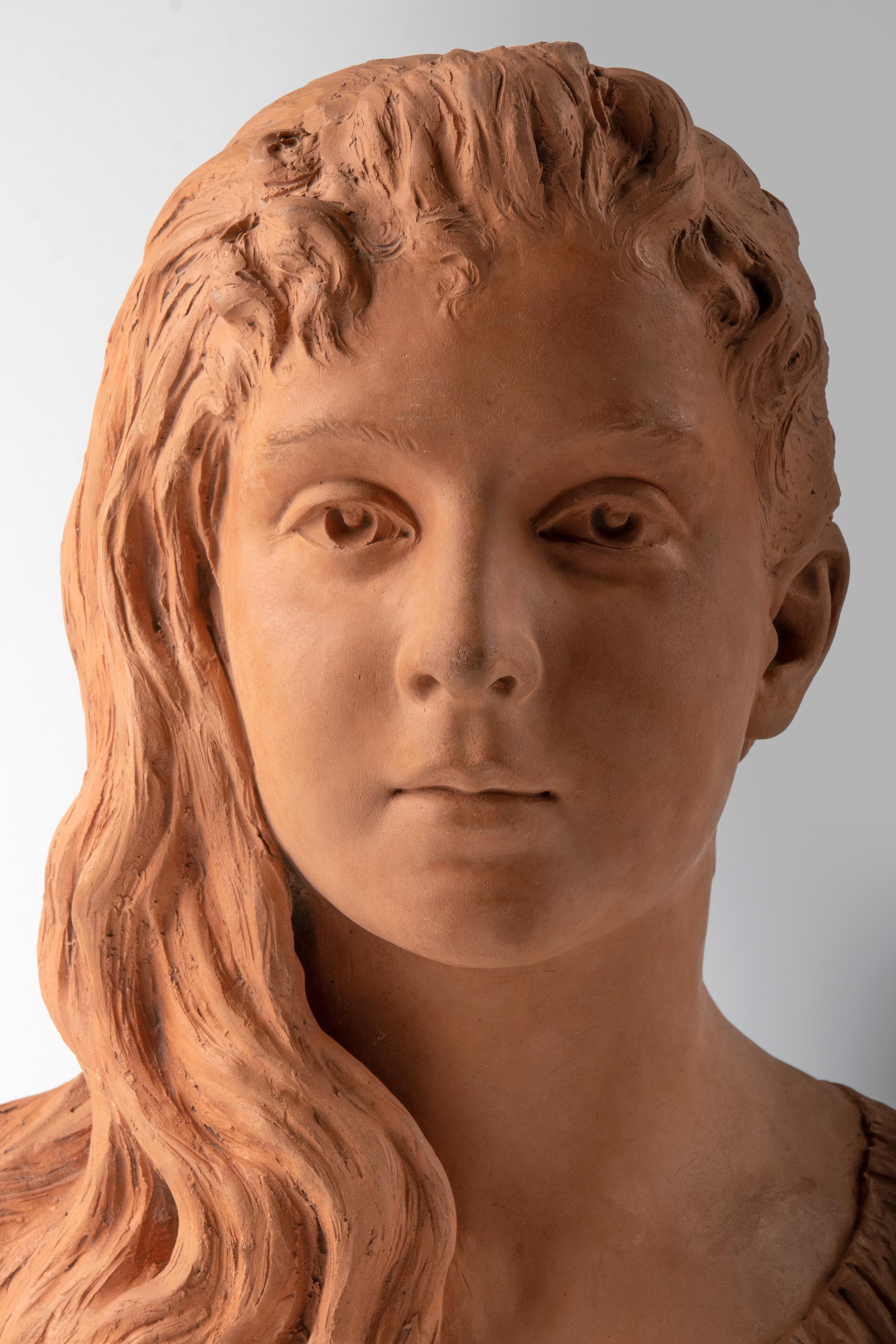 
Late 19th Century terracotta bust of a girl named Graziella. She has a sweet expression on her face. Nicely detailed sculpture. Signed on the side 'Marcel'. 

Most likely, this is a depiction of Graziella, a character created by the French author