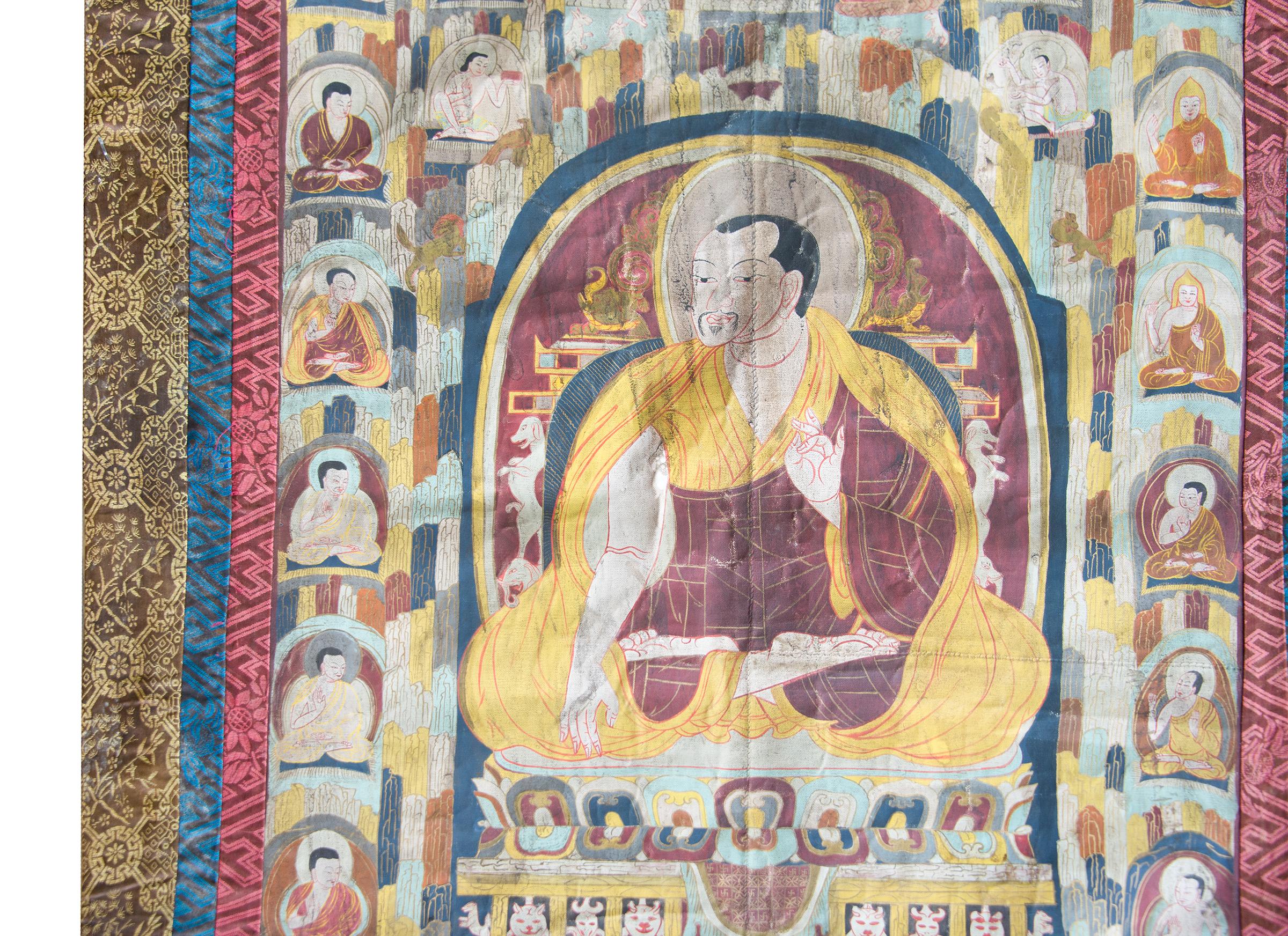 A wonderful late 19th century Tibetan Thangka depicting a portrait of a seated monk. Wearing the robes of a Tibetan Buddhist monk, the individual depicted in this portrait was probably a teacher of the Kadampa order. The painting’s patron, perhaps a