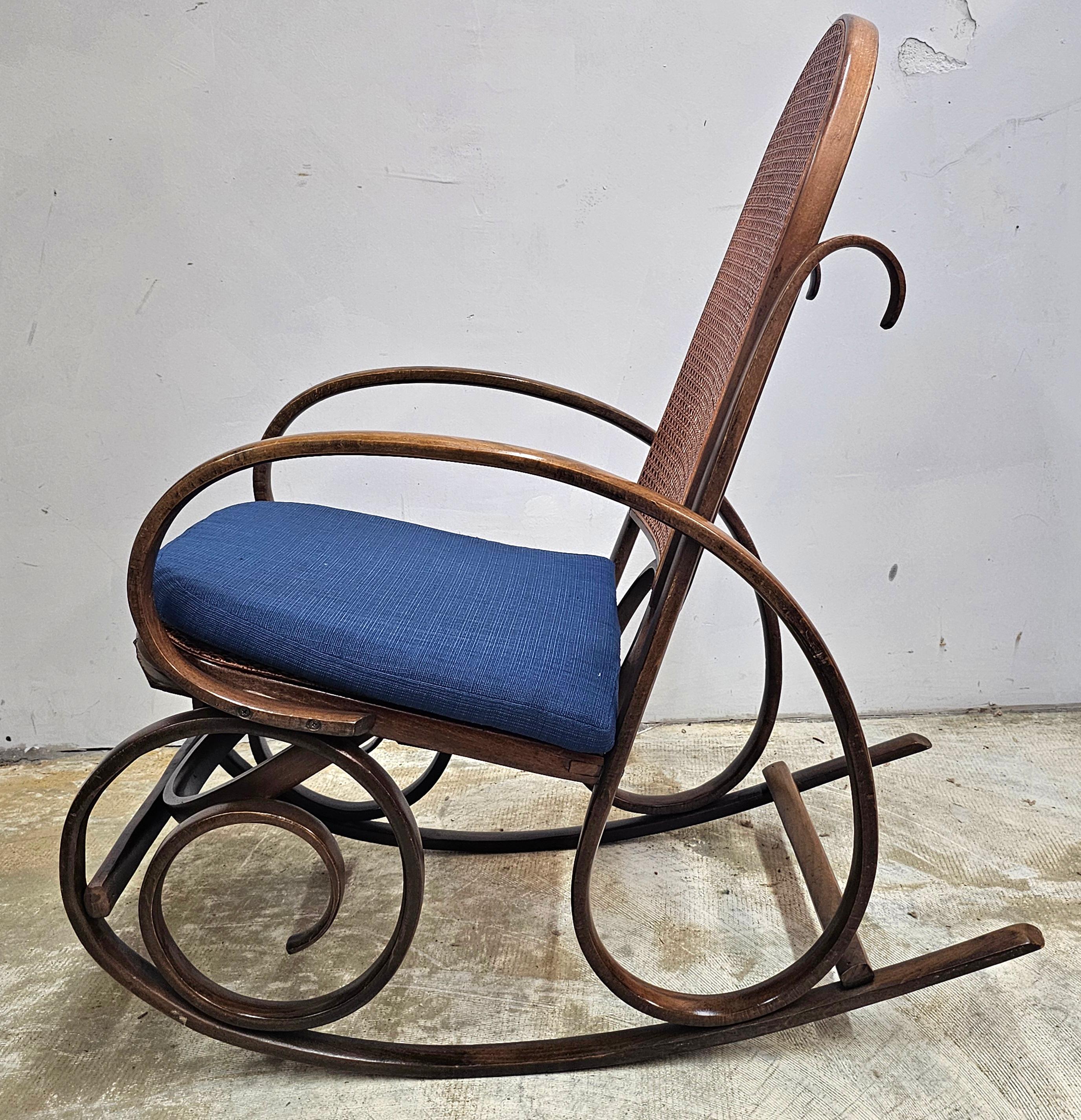 American Late 19th Century Thonet #21 Bentwood and Cane Seat Arm Rocking Chair For Sale