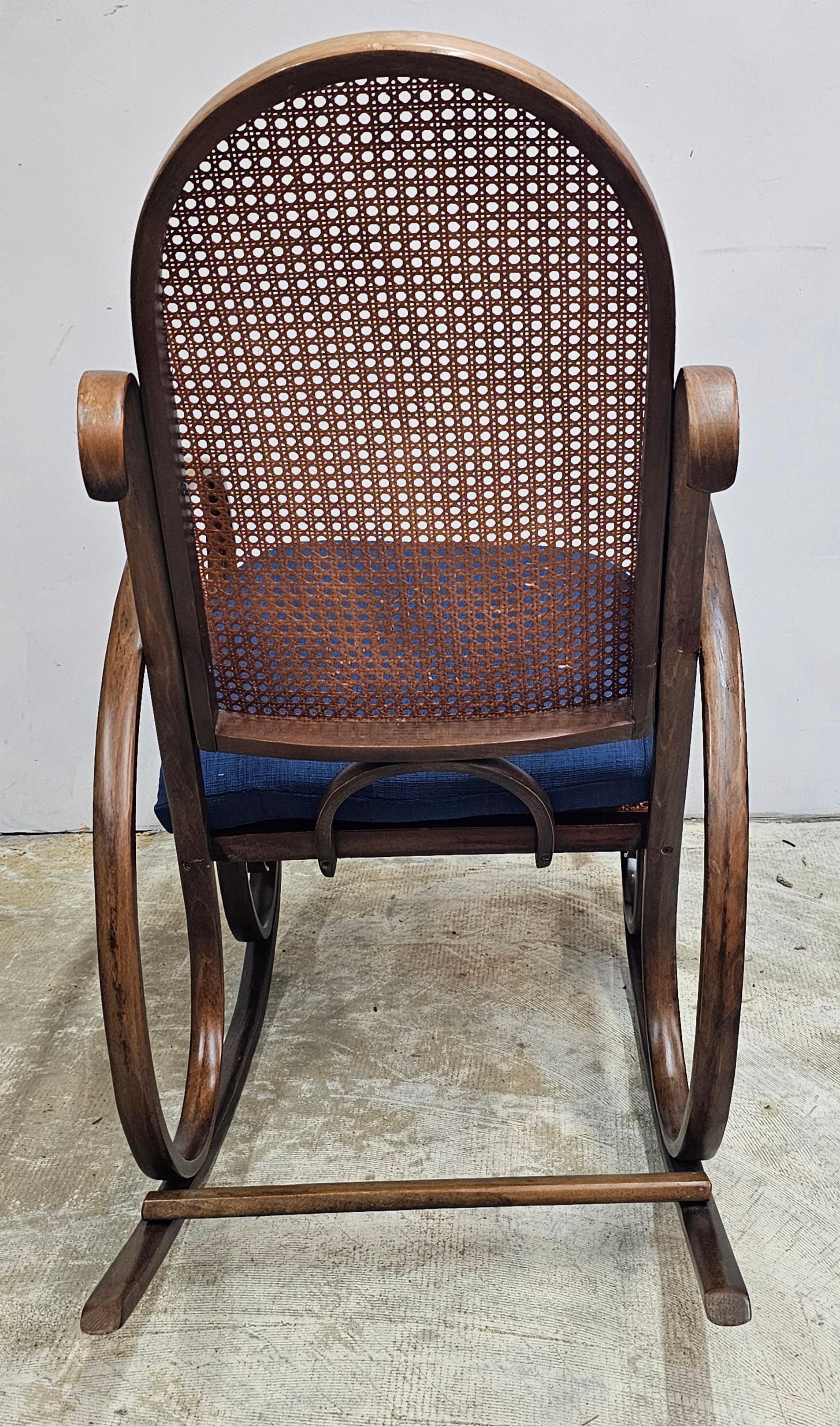 Stained Late 19th Century Thonet #21 Bentwood and Cane Seat Arm Rocking Chair For Sale