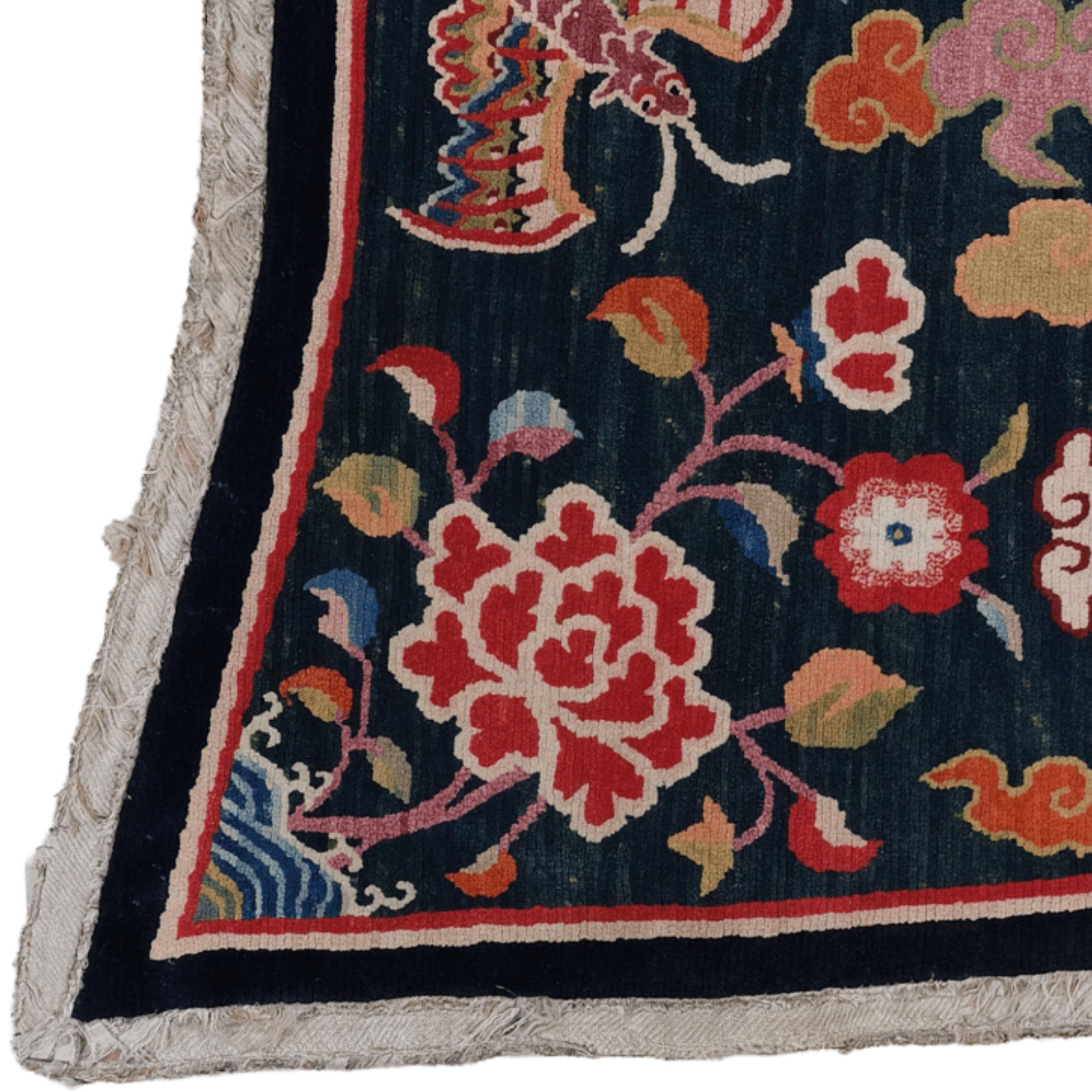 A piece of the Tibetan plateau's challenging landscape and deep-rooted nomadic tradition: this hand-woven antique saddle rug, dating back to the late 19th century, is not just a decorative element but also a vibrant cultural heritage.

This special