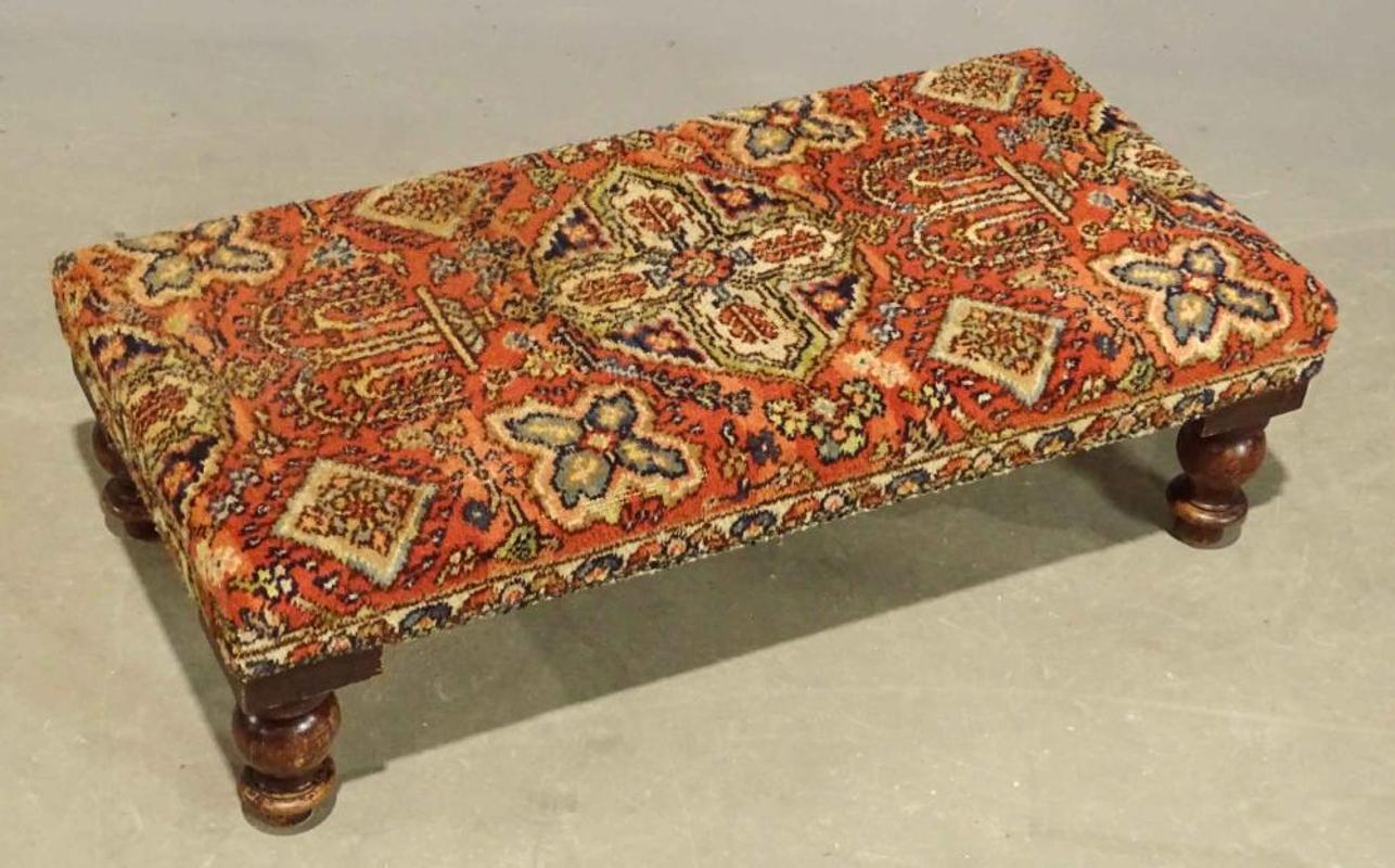 Late 19th Century to Early 20th Century Bench with Oriental rug Upholstery and Brass Nail Heads
Measures: 17