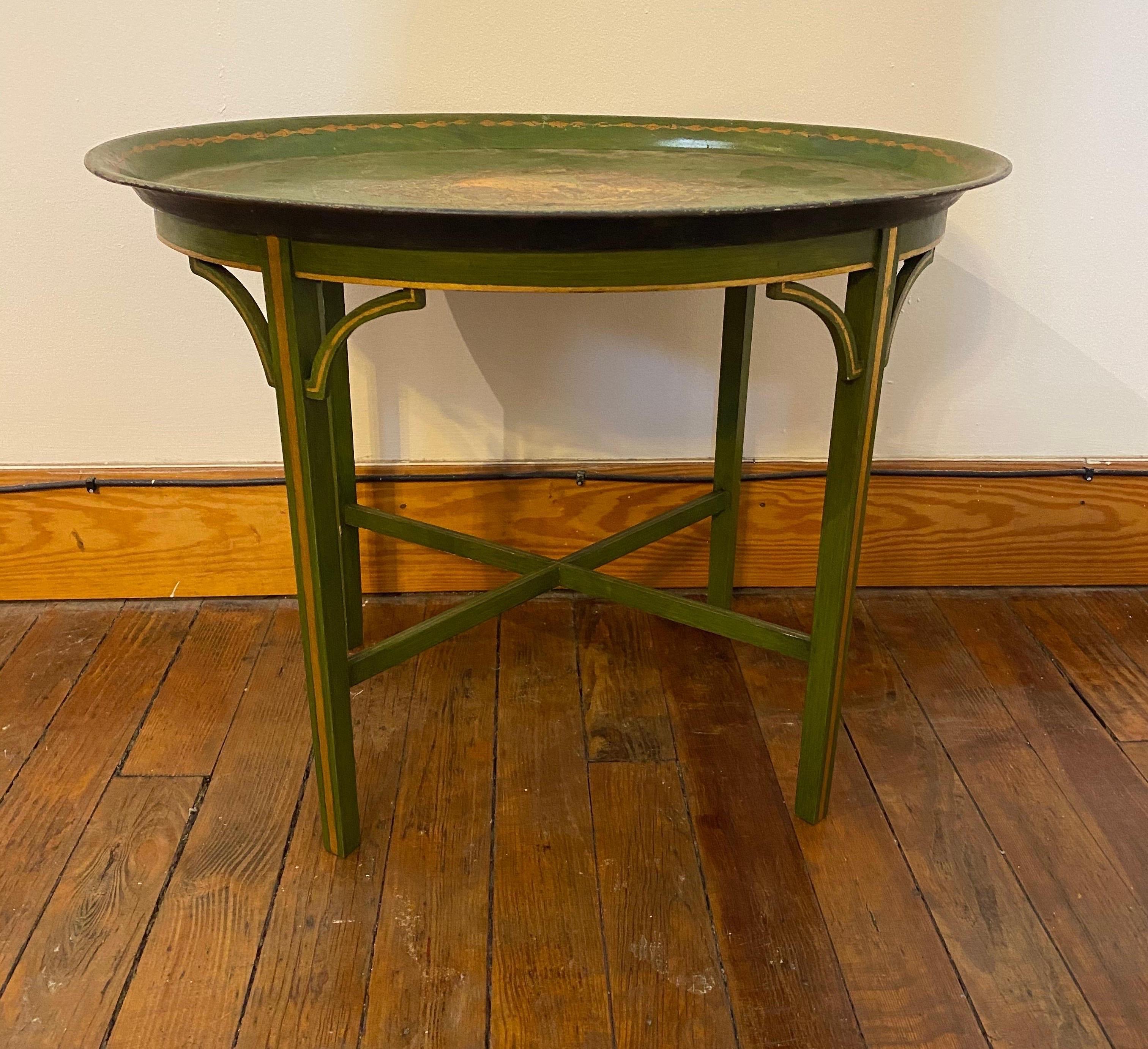Late 19th century told tray mounted as side table on wooden base.