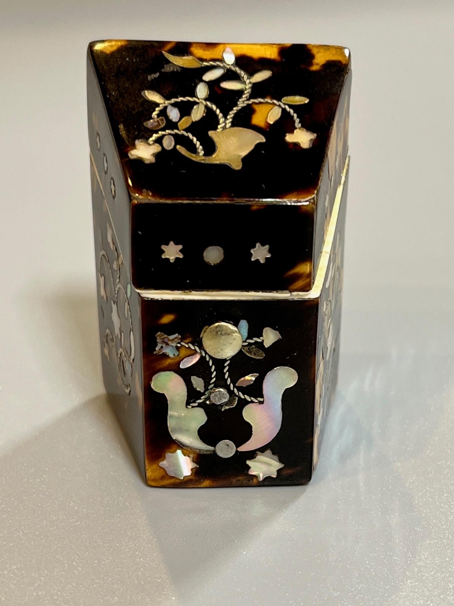 Late 19th century tortoise shell needle case with a mother of pearl inlay. A knife box shape with a hinged lid and a package of the original needles in the original packaging marked H. Milward & Sons registered Needle case Bevil Eyed No. 7. The