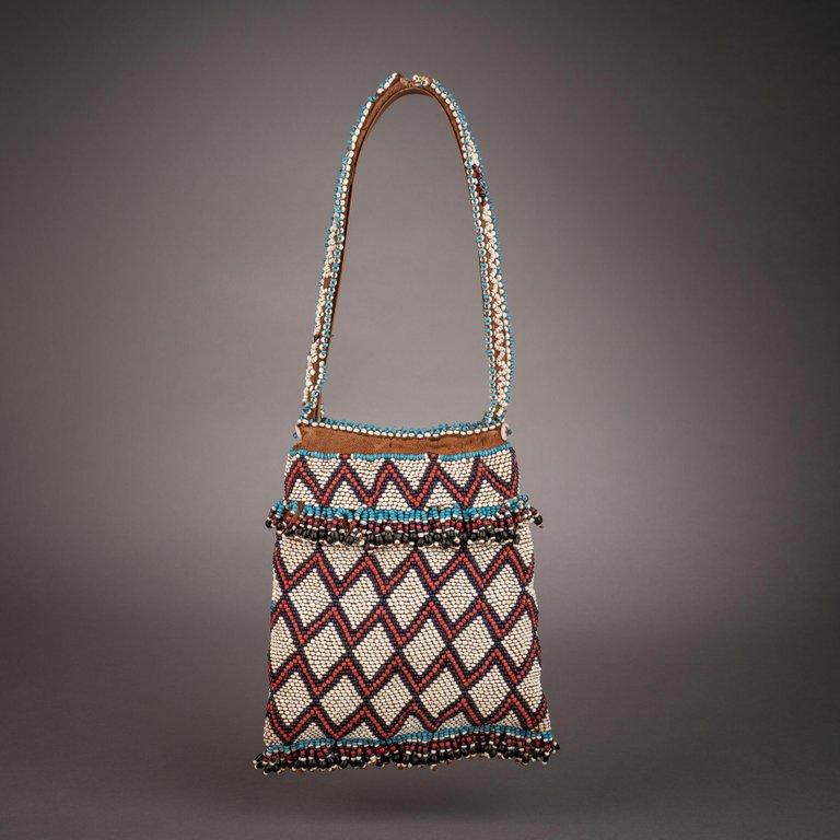 Means of carrying tobacco were as important in southern Africa as those of sampling it, and gaily beaded purses were widely produced for that purpose. Decorated as vividly as any other example of the region’s beadwork, such bags would often be worn