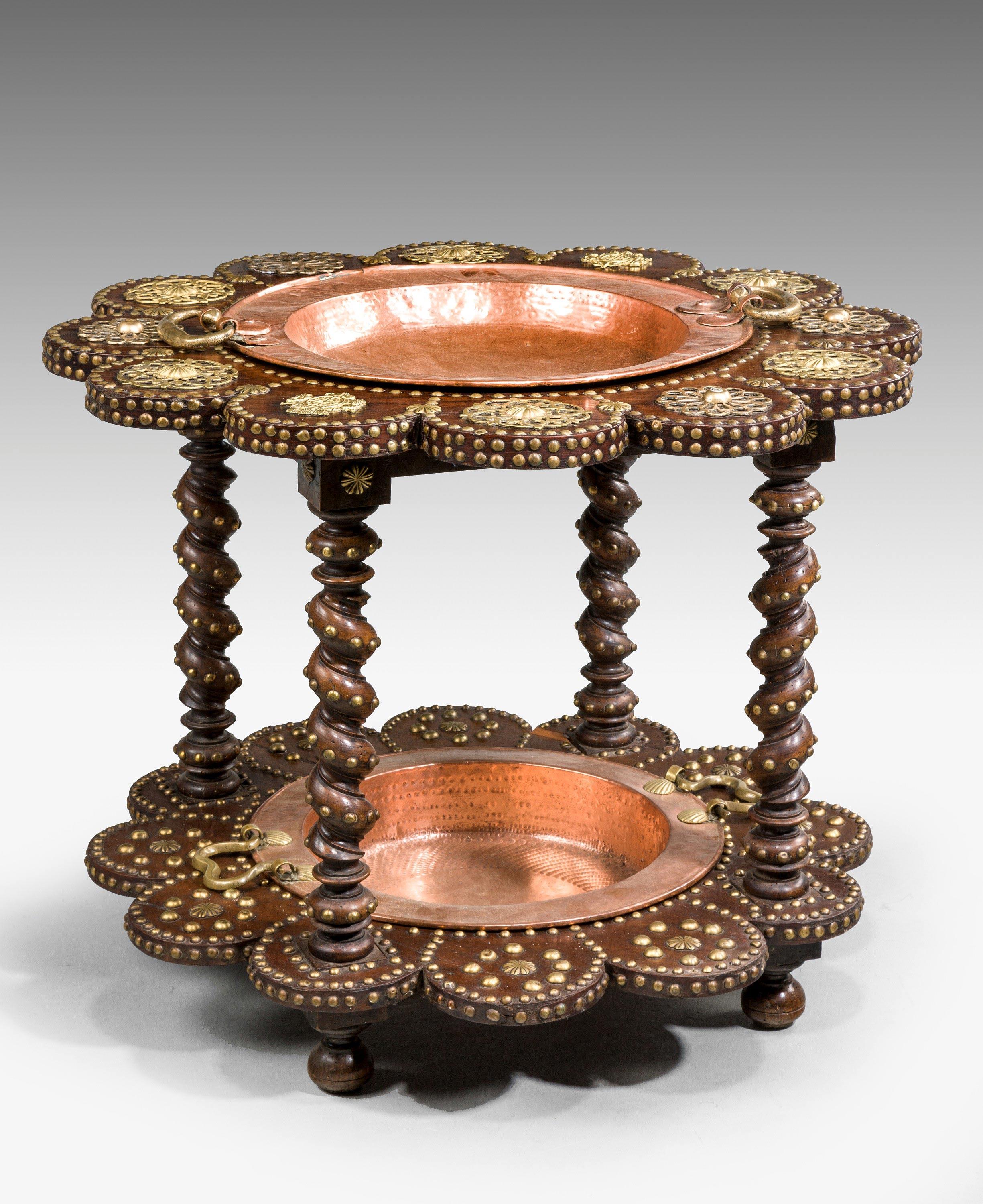 A late 19th century two-tier cooking étagère, elaborately carved and chiseled.