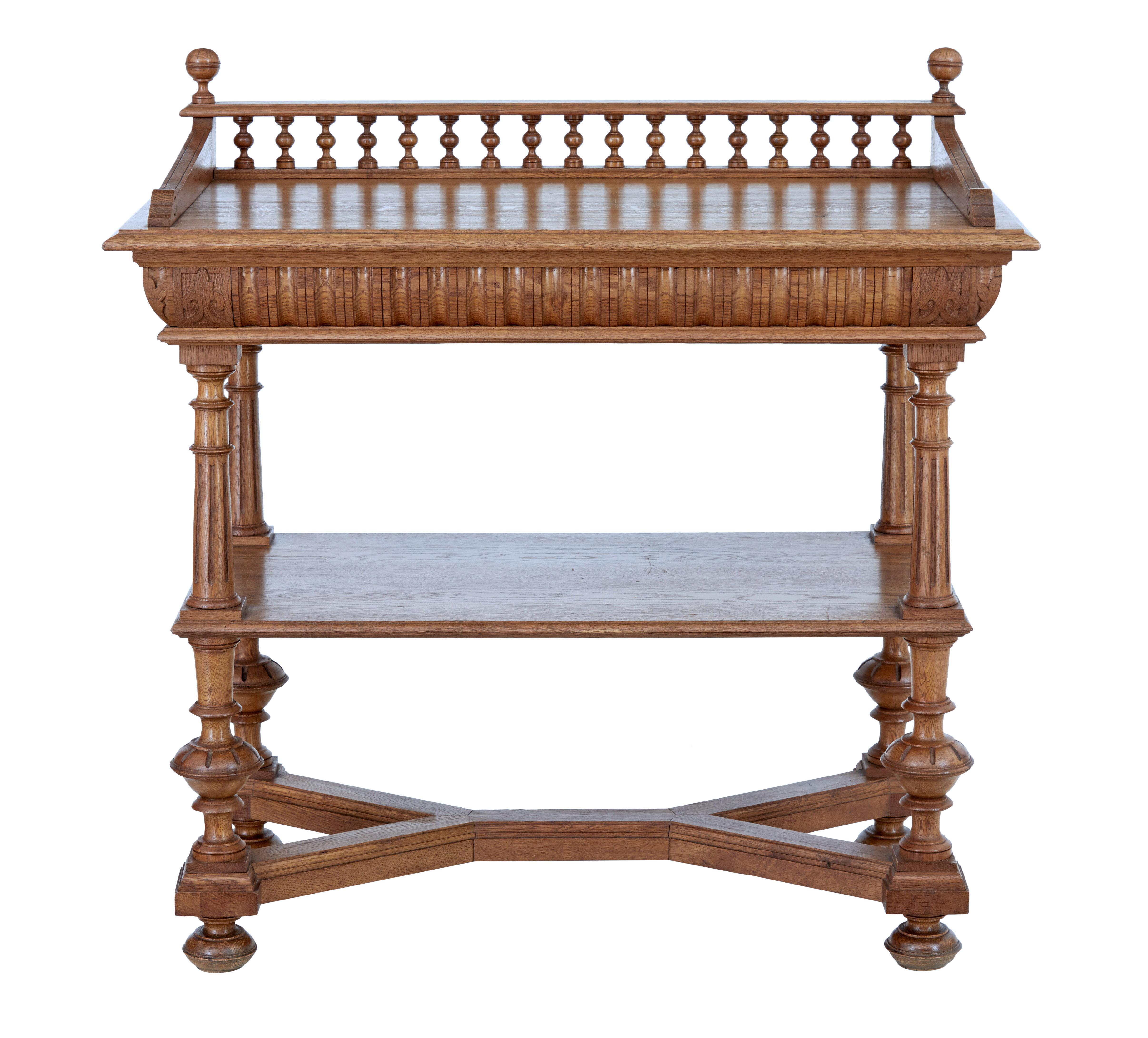 Late 19th century Victorian carved oak washstand, circa 1890.

Victorian wash stand, but with many possible uses such as a side or hall table.

Top surface with spindle gallery surround, standing on 4 turned legs which support a further shelf.