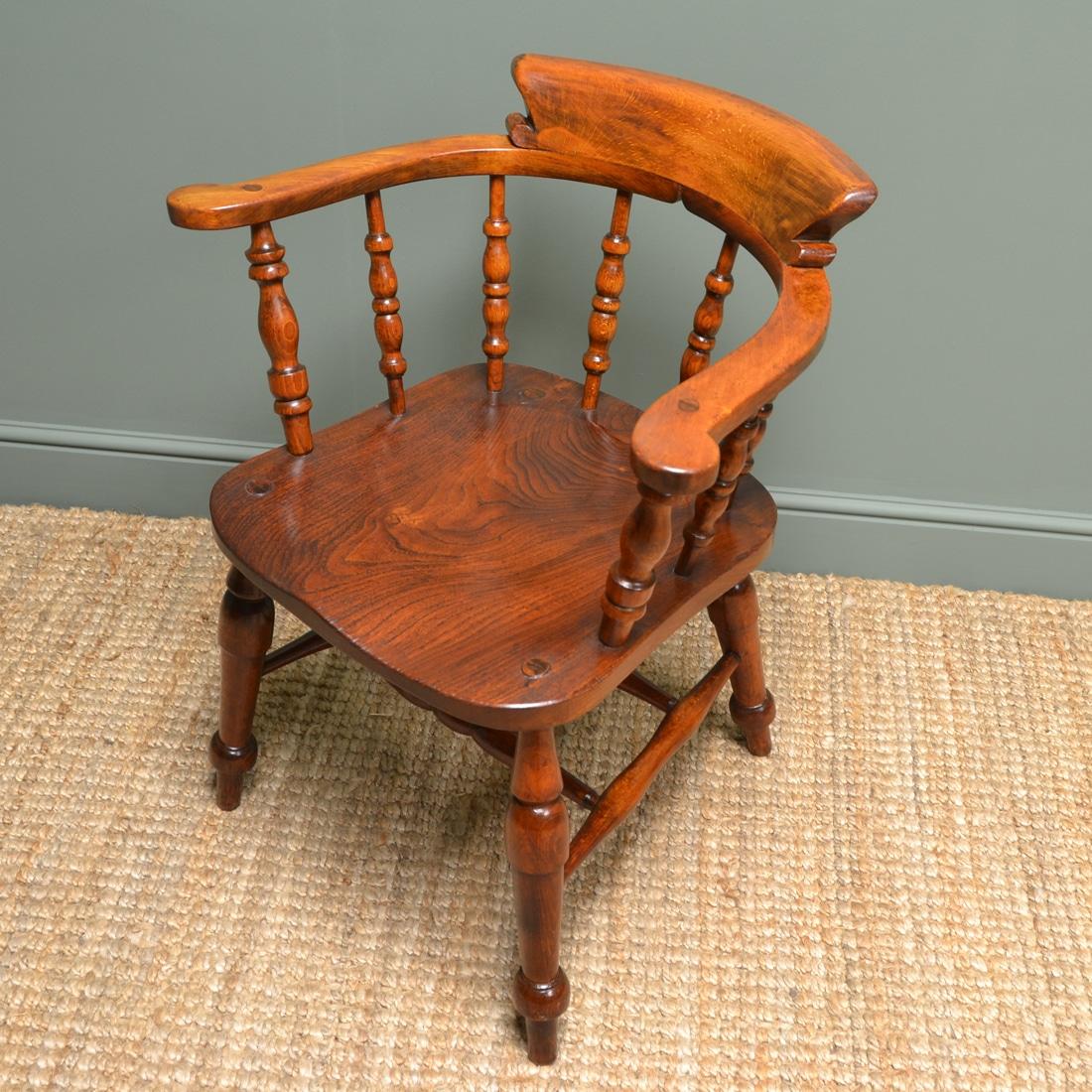 British Late 19th Century Victorian Figured Elm Smokers Bow Antique Carver Chair For Sale