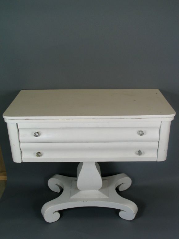 1-605 two-drawer console on pedestal base with crystal knobs painted white.
 