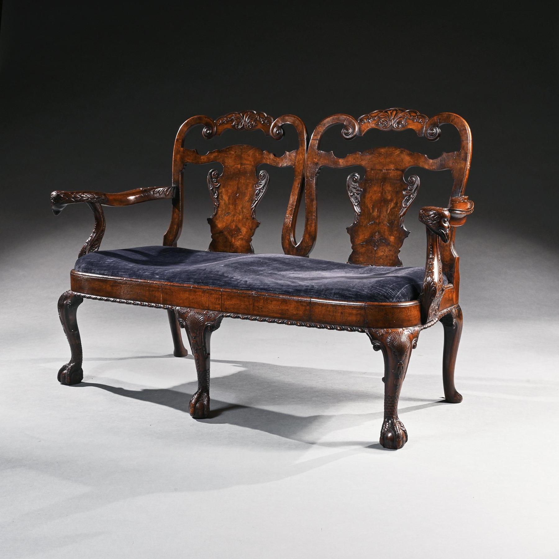 A superb quality late Victorian walnut double chair back sofa / settee after a George II design of Giles Grendey’s.



English 1880.



A wonderful sofa having scroll back supports with carved crestings above vase shaped splats with