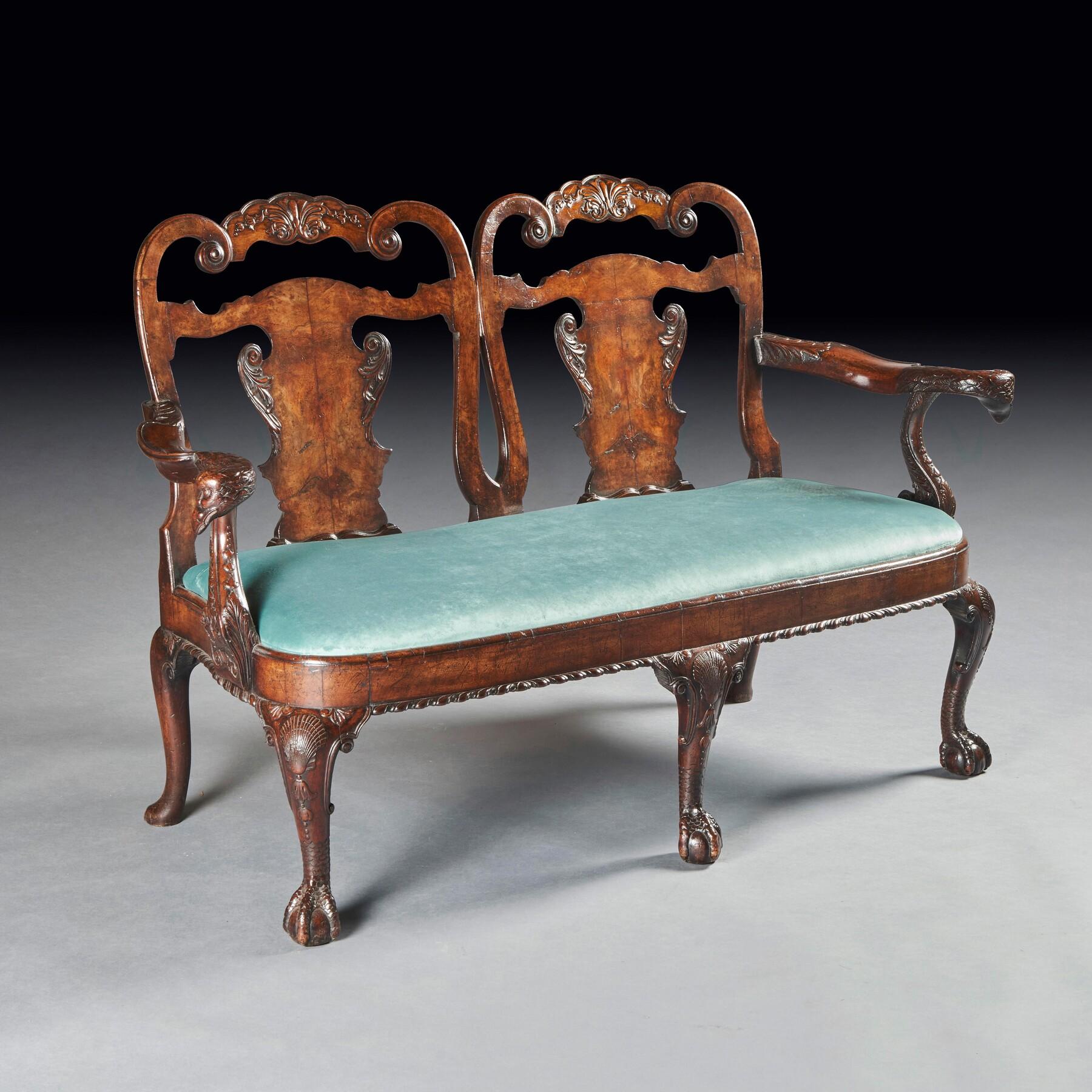 A superb quality late 19th century walnut double chair back sofa / settee after a George II design of Giles Grendey’s .

English Circa 1880.

A wonderful sofa having scroll back supports with carved crestings above vase shaped splats with segmented