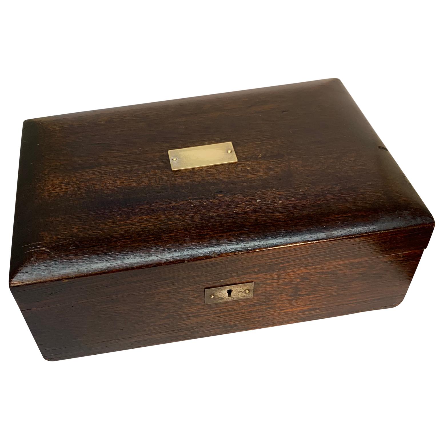 Late 19th century wooden box with polished zinc insert and brass plaque

Brass plaque has not been engraved.