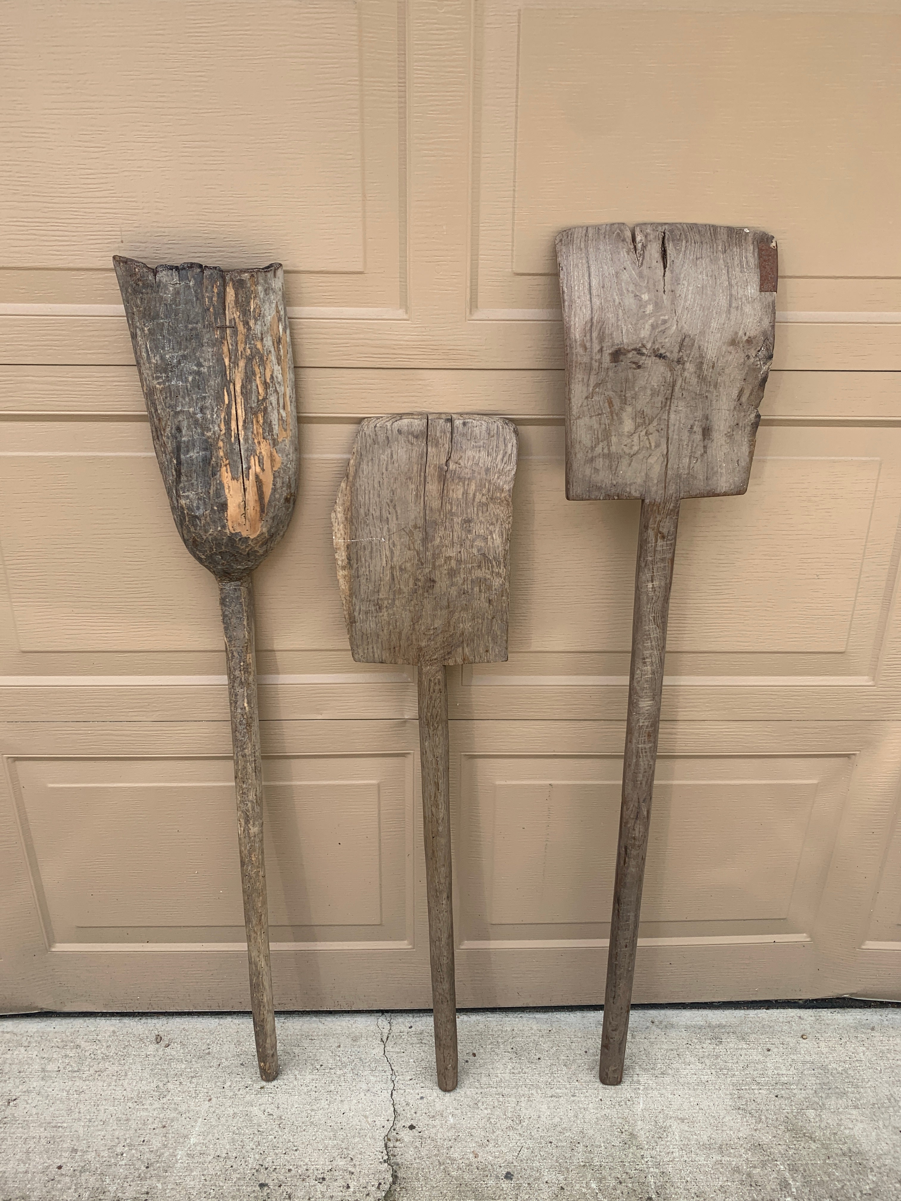 A beautiful set of three antique wooden hand made garden tools. These would be ideal for an installation on a large wall on custom wall mounts.

USA, Circa late 19th century

Left measures: 7.5
