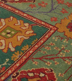 19th Century Handwoven Wool Donegal Rug, Ireland, Green Floral Design