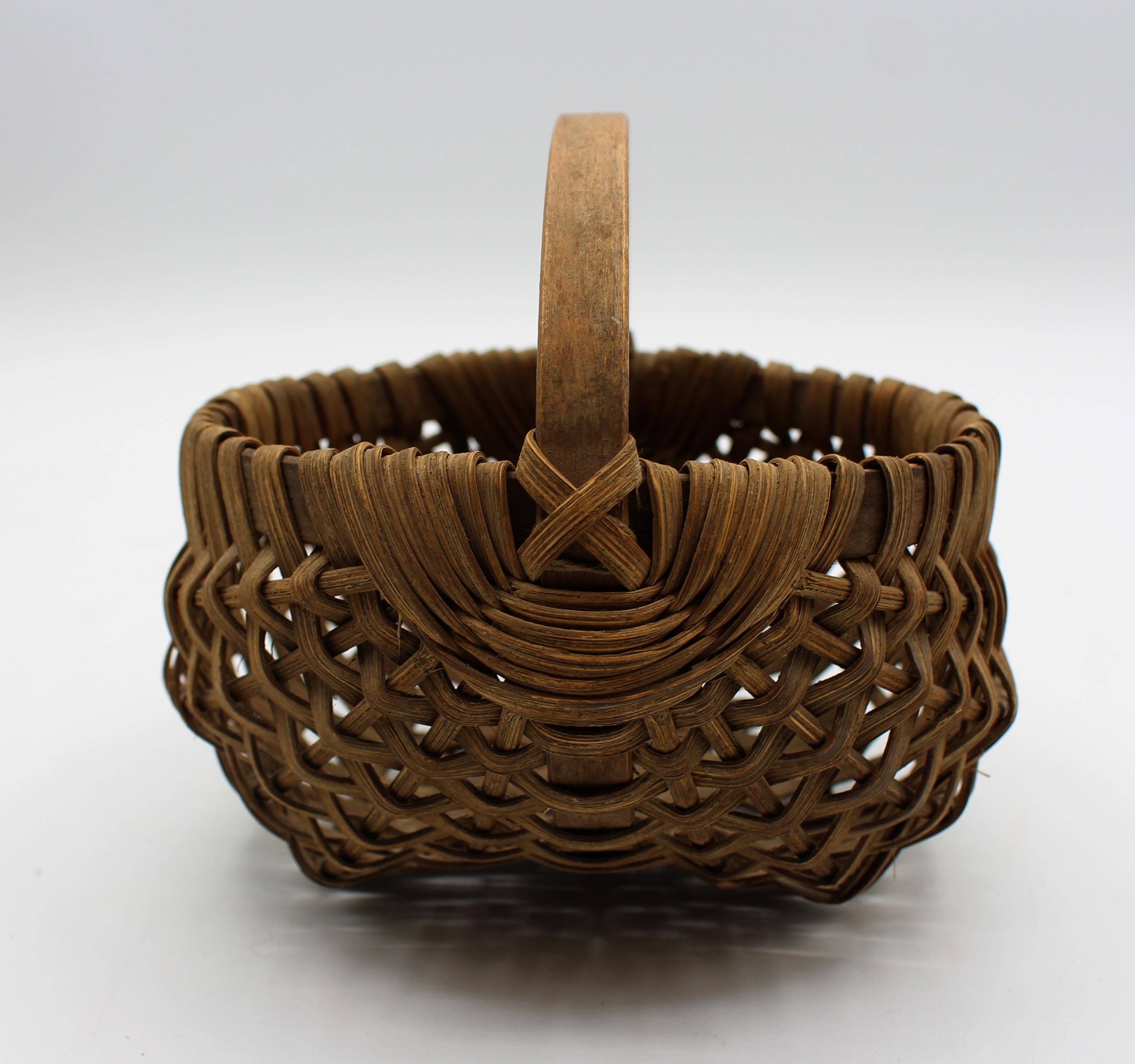 Late 19th century woven double shape basket, American. Superbly made. Note the exceptional woven design around the handle drops. 3.25