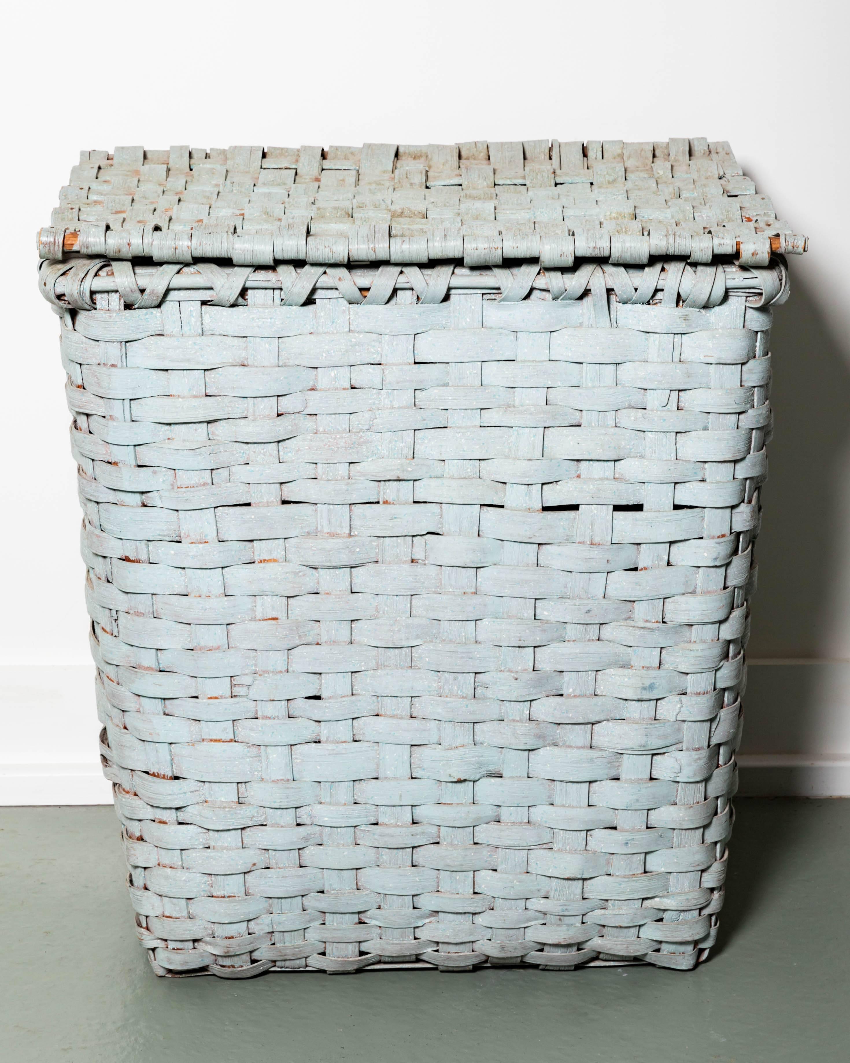 This very large late 19th century oak splint basket has hand cut wood construction with original hinges on the lid, and a grey blue painted surface which is early 20th century.