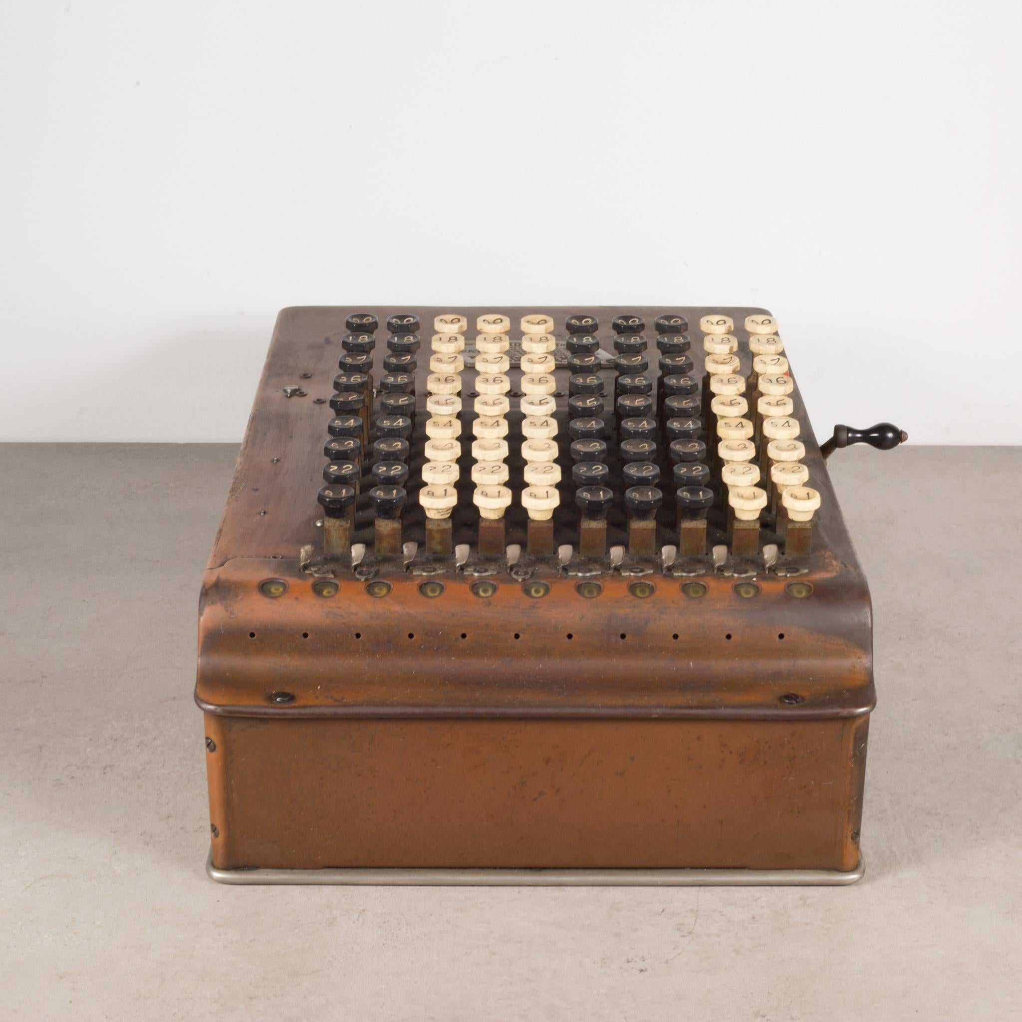 About
An antique Comptometer copper and tin adding machine with white and black Bakelite buttons and original metal manufactures tag and embossed side decorations. The lever pulls forward and back working the inner mechanisms. The piece has