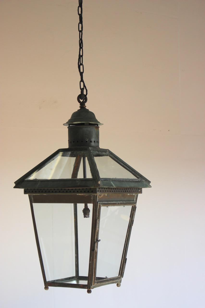 A late 19th-early 20th century English copper lantern with good verdigris color and proportions, rewired for the UK.
England,
circa 1900.
