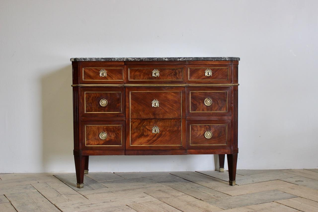 A fine quality late 19th-early 20th century French mahogany commode with a lovely color retaining the original bronze mounts and marble top.
France, circa 1800-1830.