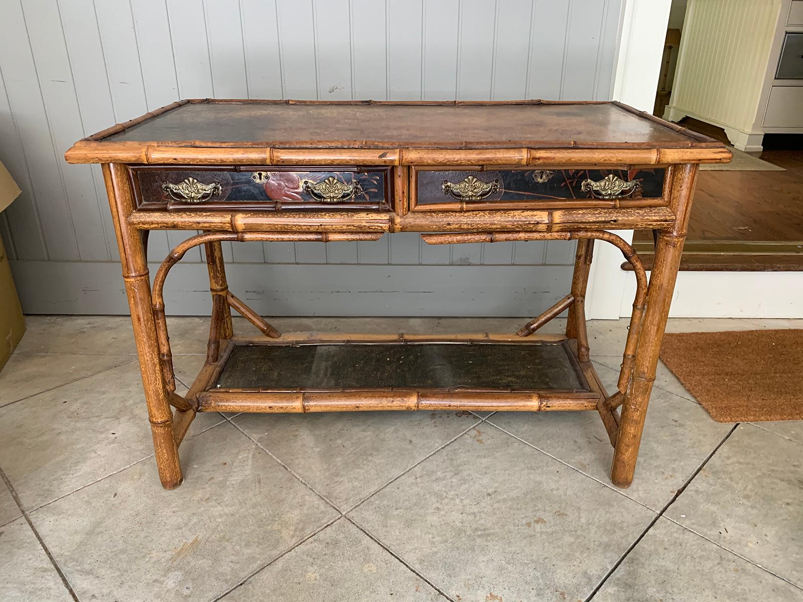 Late 19th-early 20th century bamboo desk with leather top
Measures: 43