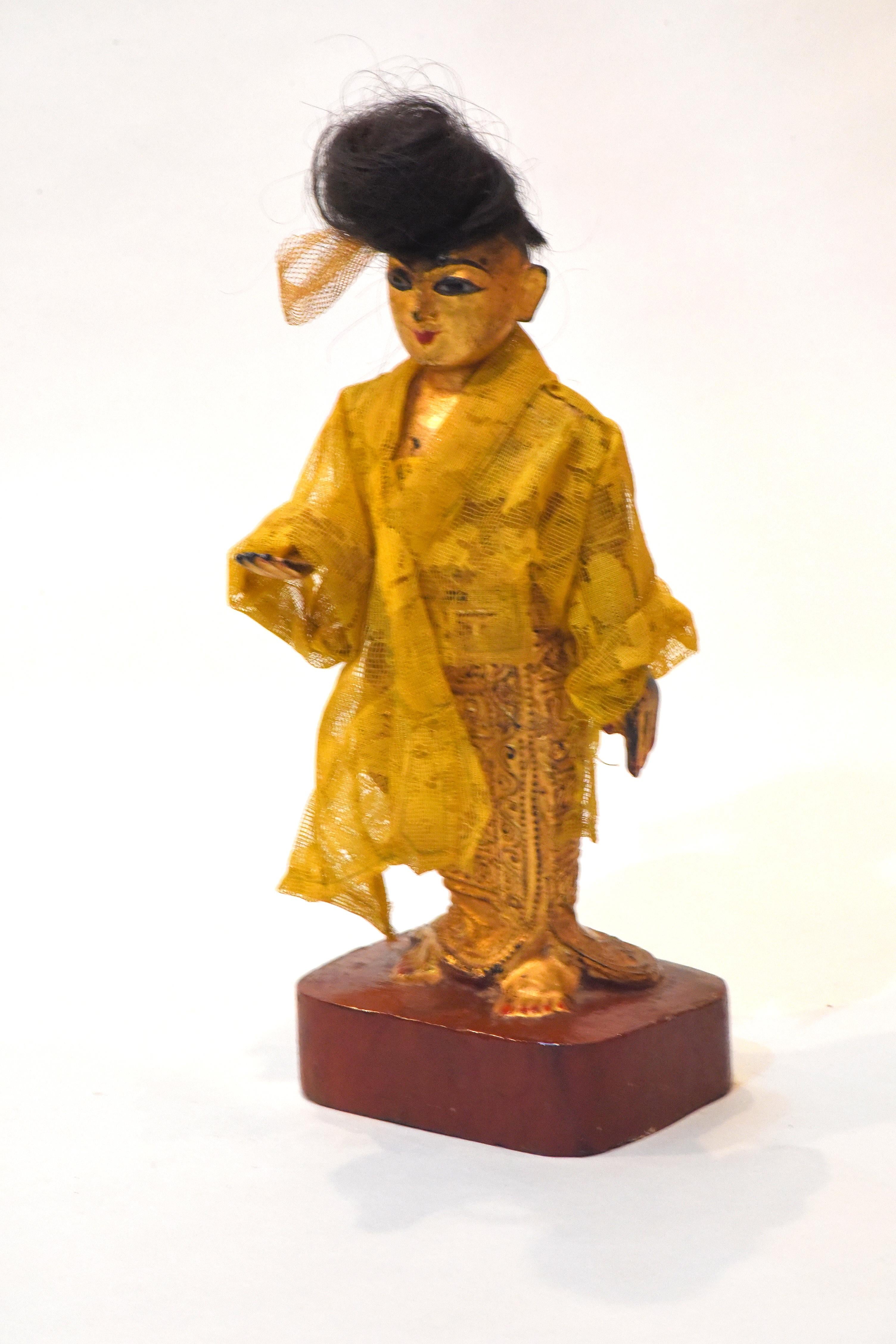 A Burmese Nat-Pwe standing female figure, carved of wood, possibly representing Shingwa, 