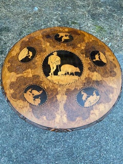 Late 19th-Early 20th Century Carved and Inlaid Black Forest Table with Stags