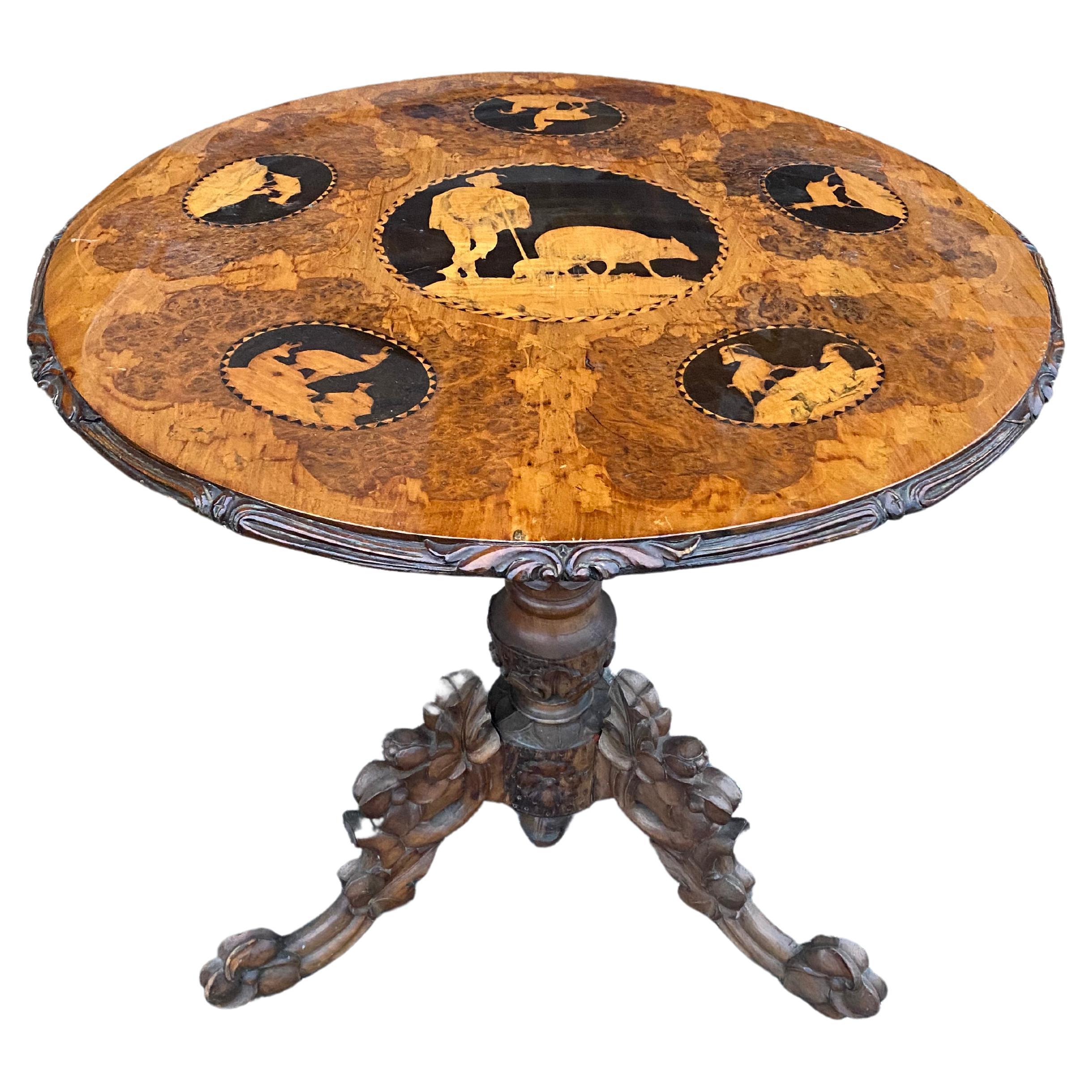 Late 19th-Early 20th Century Carved and Inlaid Black Forest Table with Stags